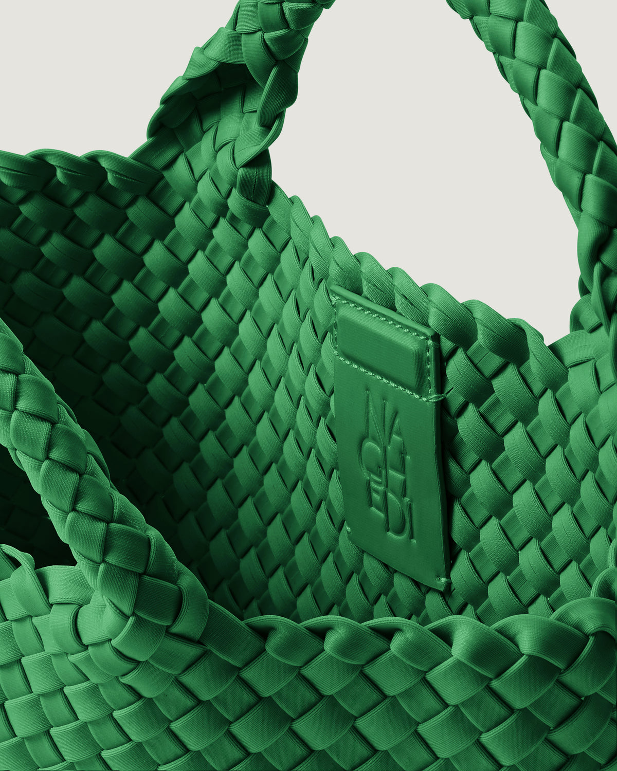 Interior close-up of St. Barths Tote in Emerald showing its magnetic snap closure, and unlined interior.
