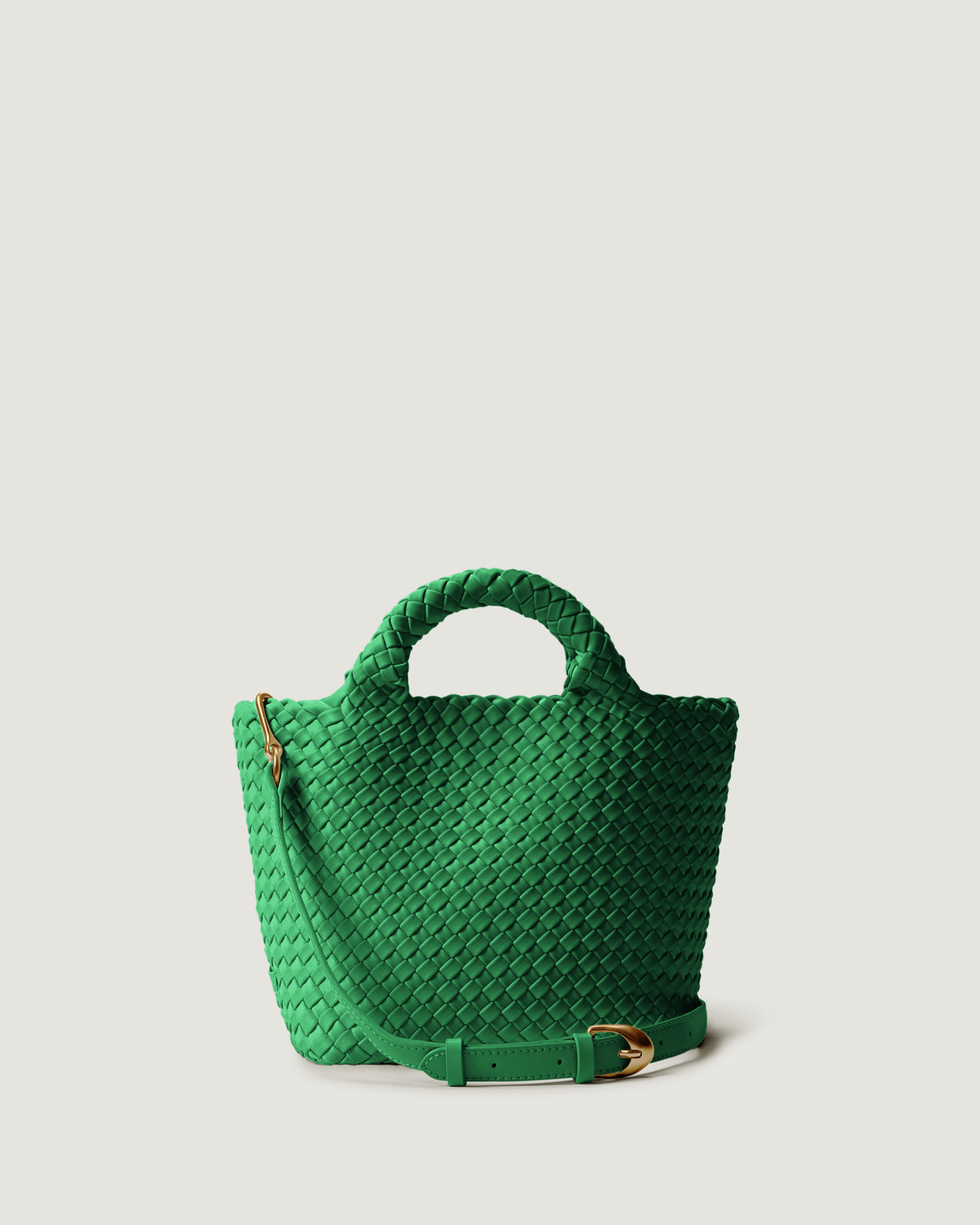 St. Barths Tote in Emerald in handwoven neoprene, featuring a magnetic closure, woven top handles, and detachable, adjustable leather crossbody strap.