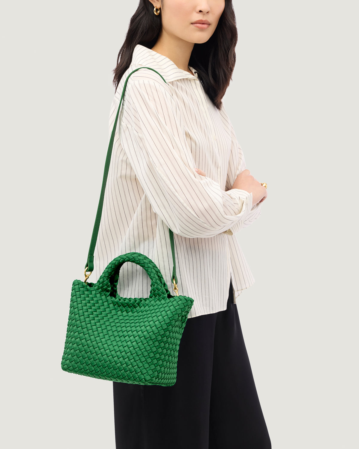 St. Barths Tote in Emerald shown on model to illustrate scale and soft silhouette.