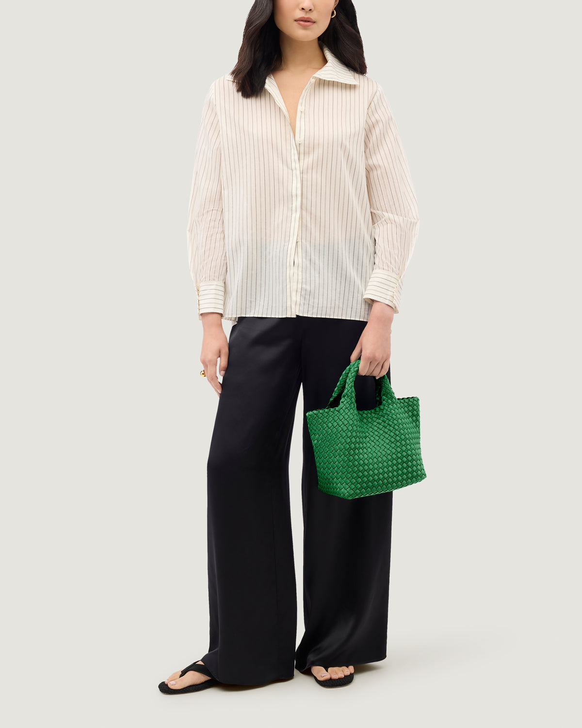 St. Barths Tote in Emerald shown on model to illustrate scale and soft silhouette.