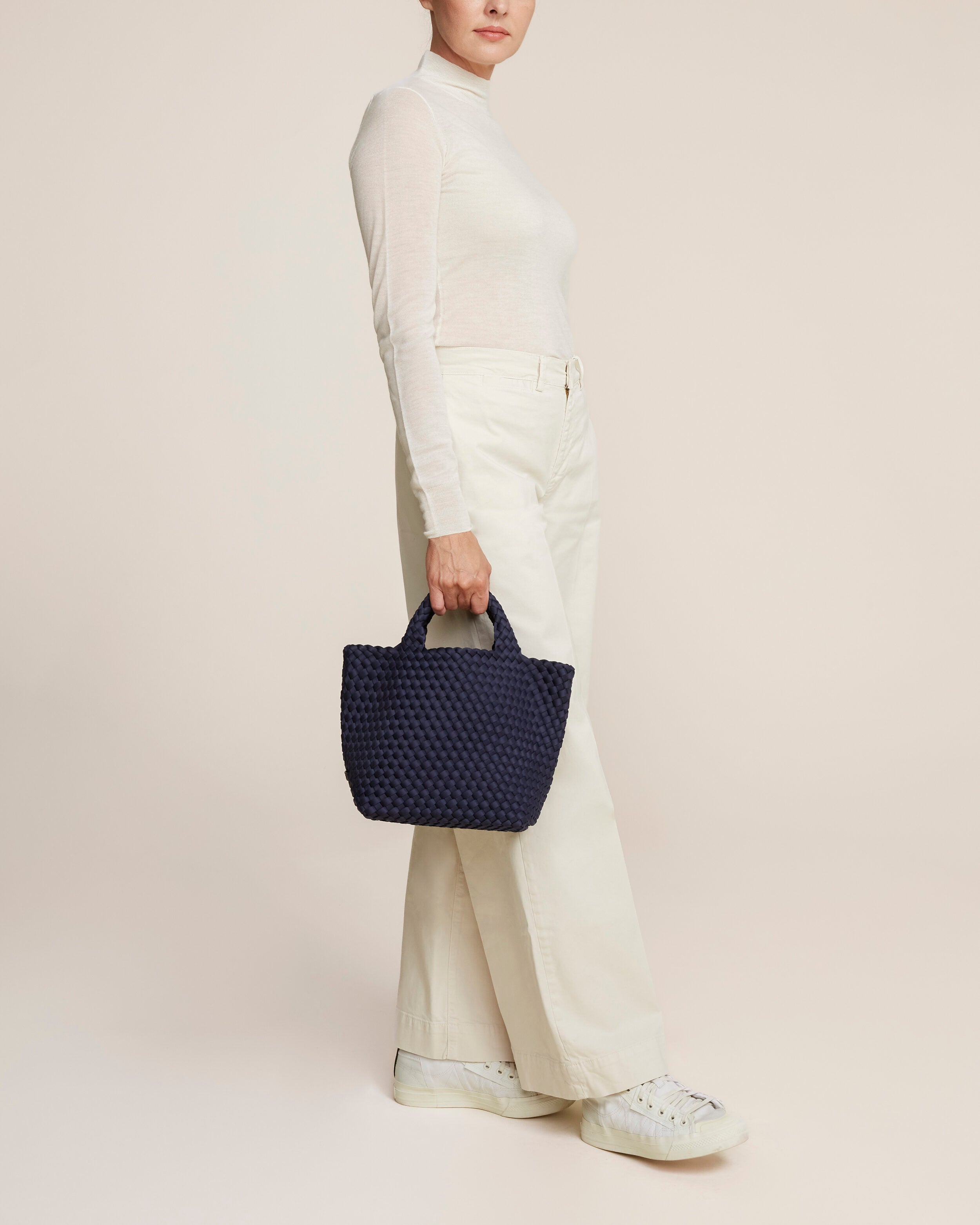 St. Barths Tote in Ink Blue shown on model to illustrate scale and soft silhouette.