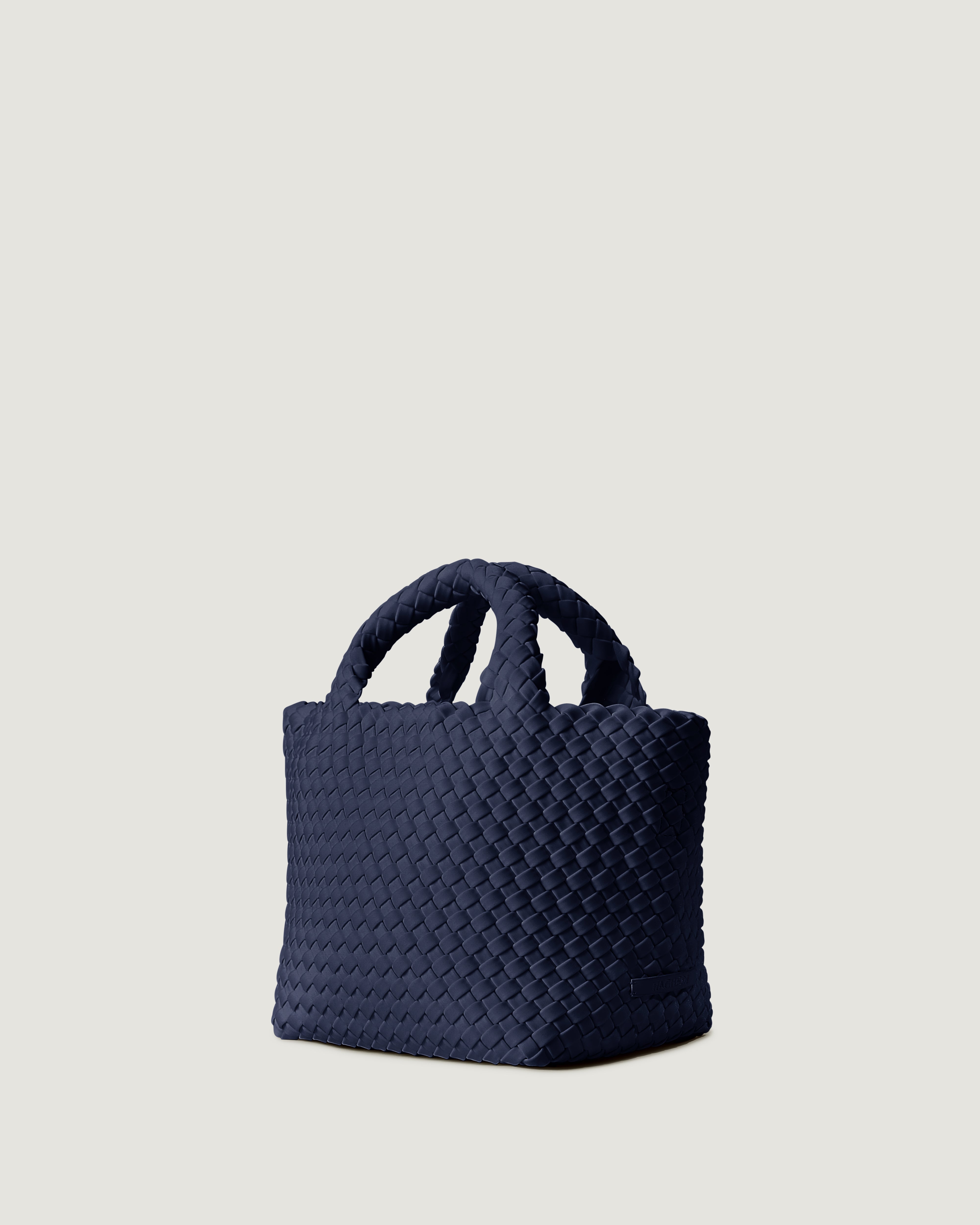 Side view of ink blue small tote bag