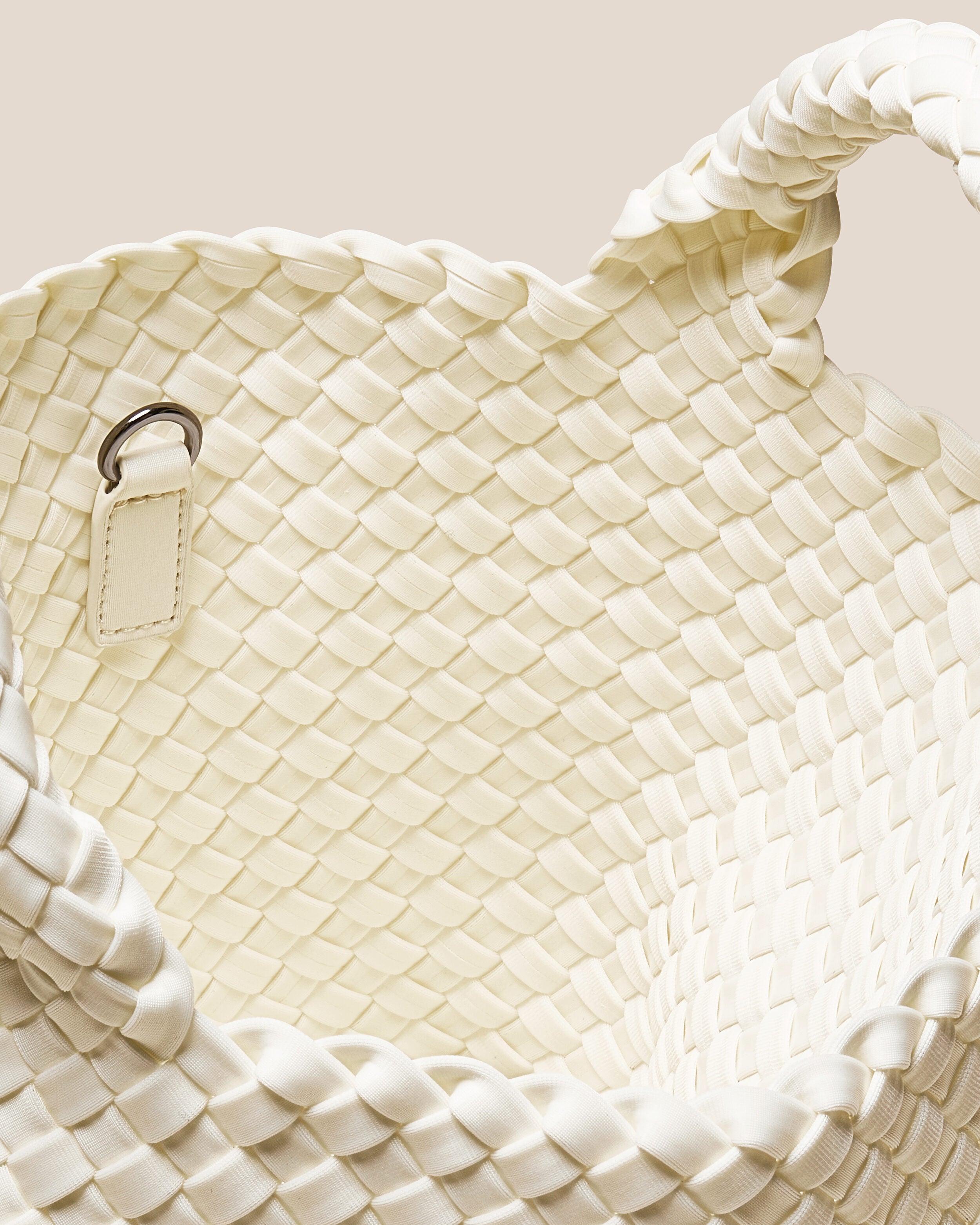 Interior close-up of St. Barths Tote in Jasmine showing its open top, and unlined interior.