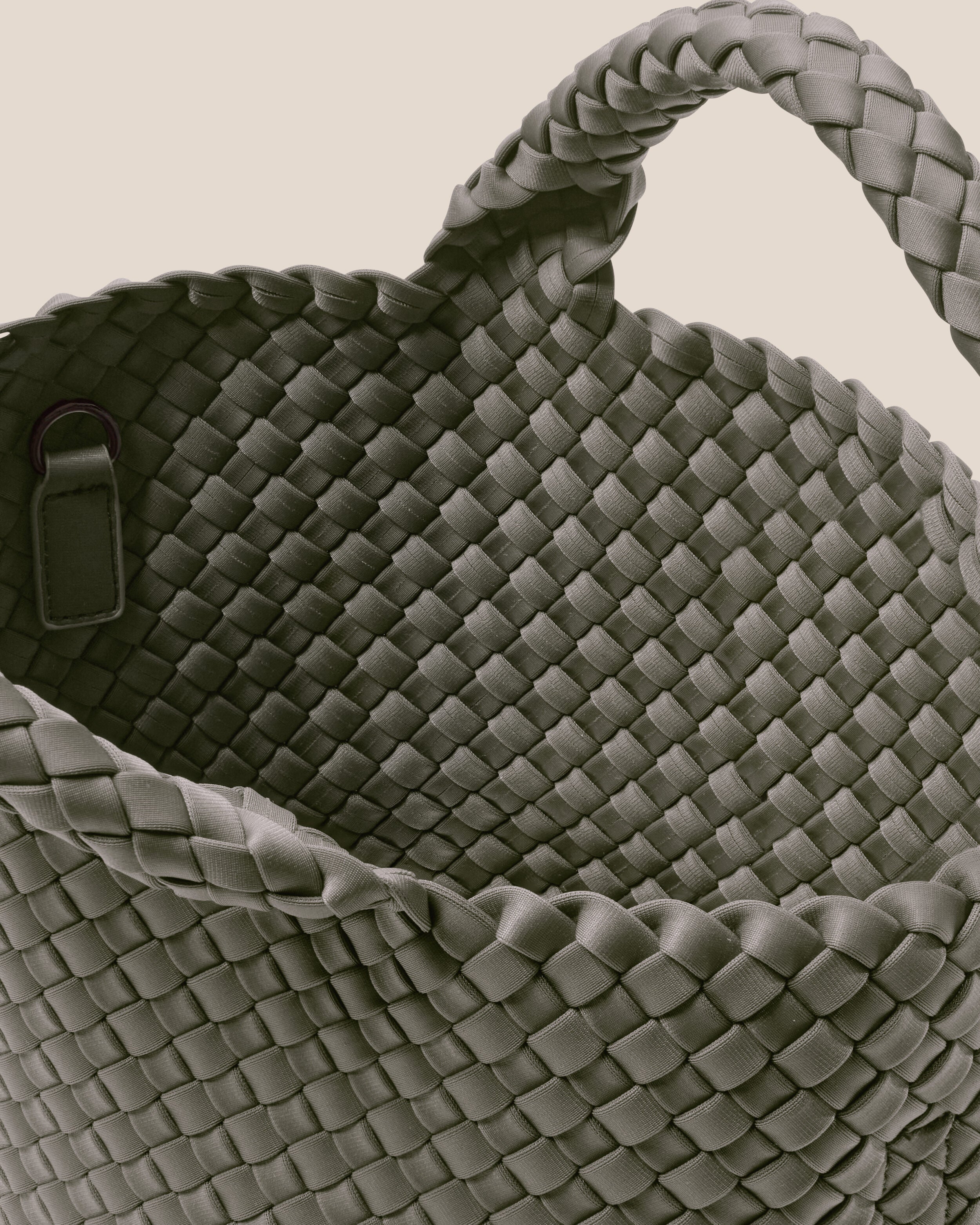Interior close-up of St. Barths Tote in Laurel showing its open top, and unlined interior.