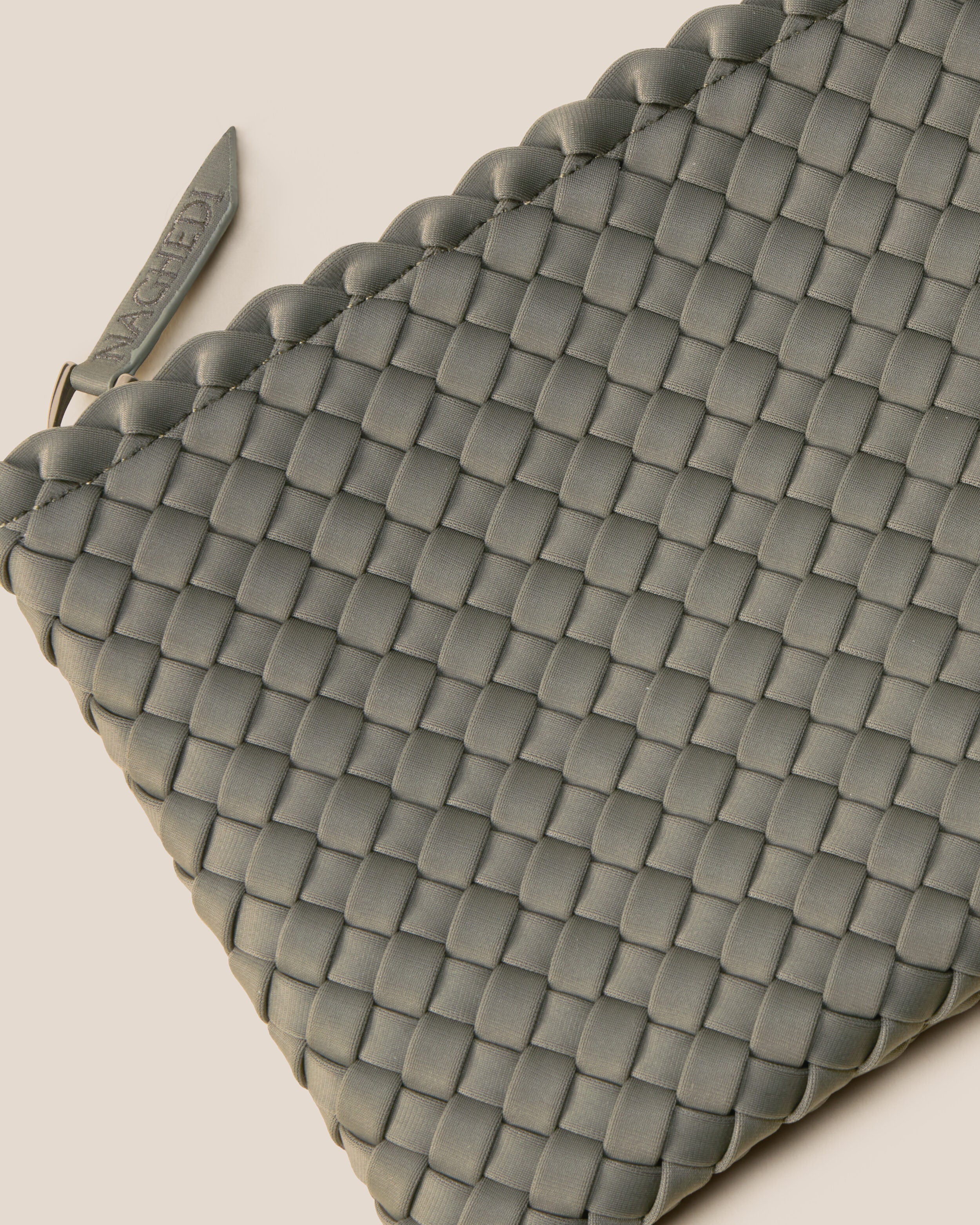 Close-up of included matching woven zippered pouch.