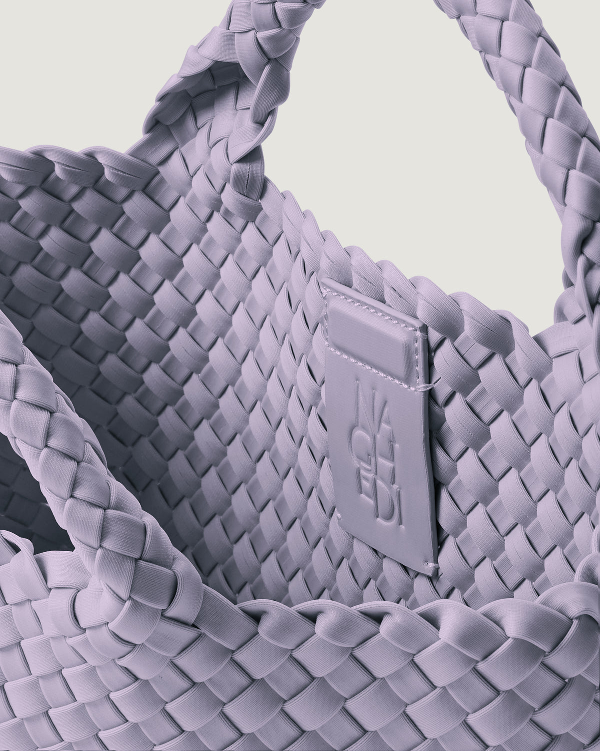 Interior close-up of St. Barths Tote in Lilac showing its magnetic snap closure, and unlined interior.