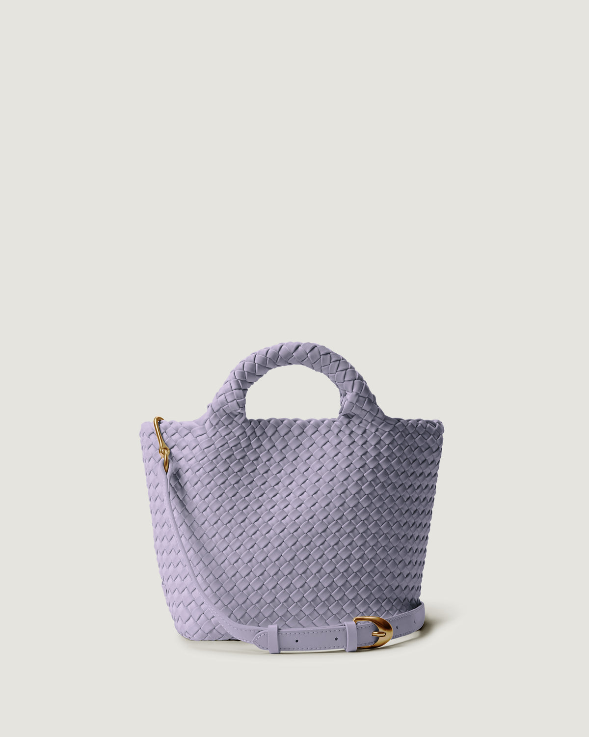 St. Barths Tote in Lilac in handwoven neoprene, featuring a magnetic closure, woven top handles, and detachable, adjustable leather crossbody strap.