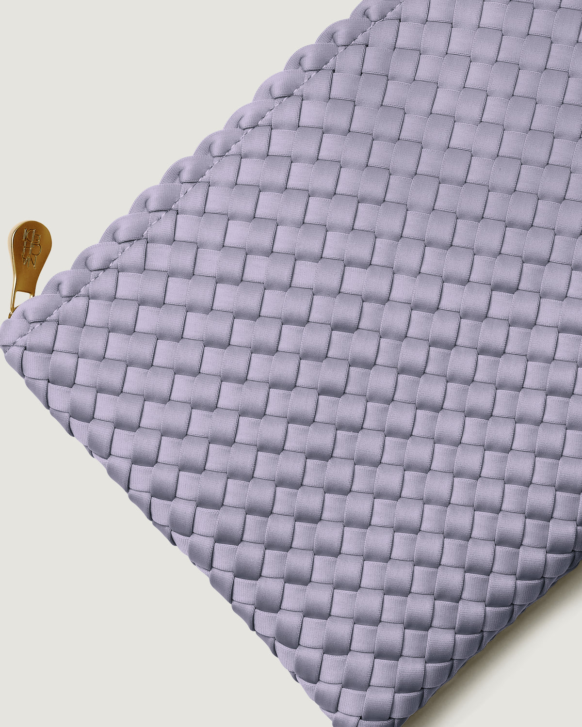 Close-up of included matching woven zippered pouch.