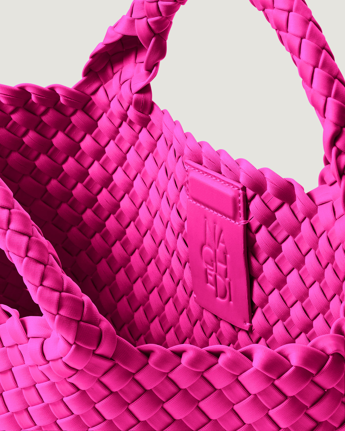 Interior close-up of St. Barths Tote in Miami Pink showing its magnetic snap closure, and unlined interior.