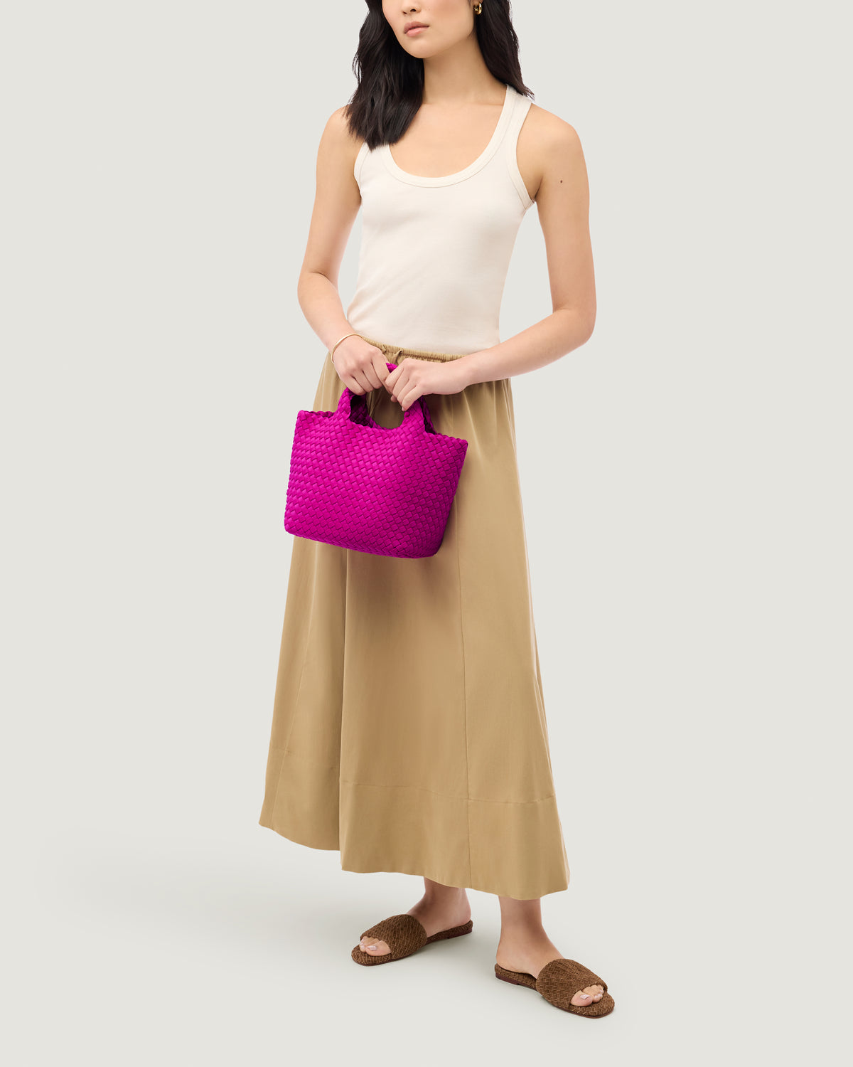 St. Barths Tote in Miami Pink shown on model to illustrate scale and soft silhouette.