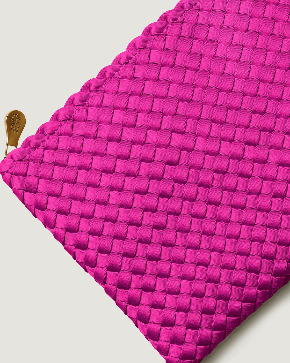 Close-up of included matching woven zippered pouch.