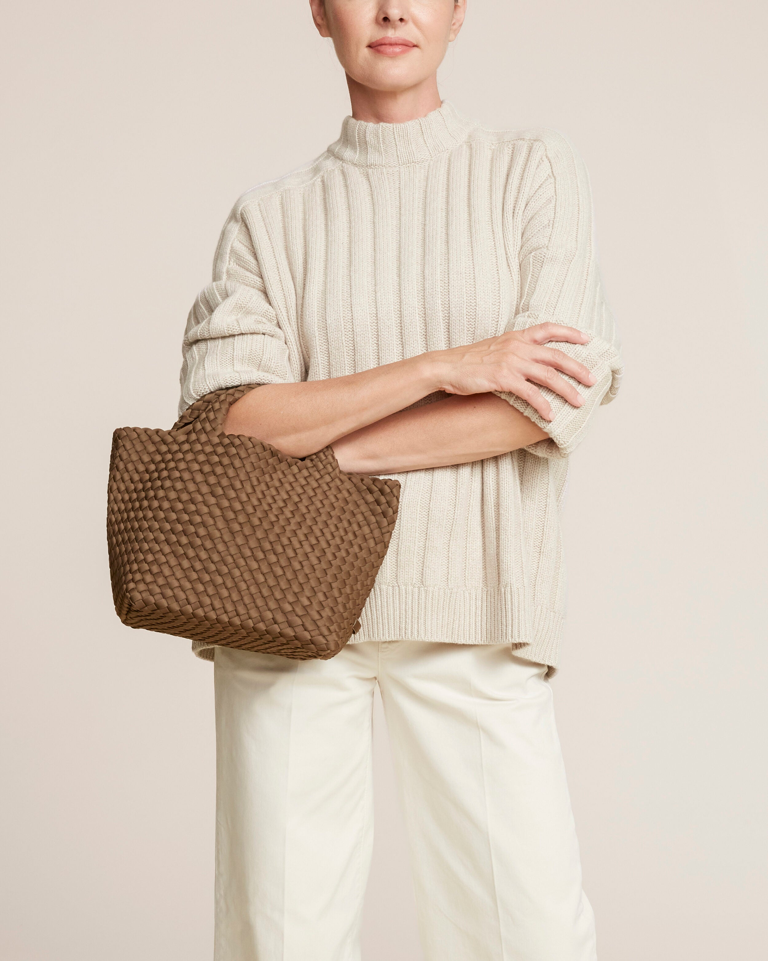St. Barths Tote in Mink shown on model to illustrate scale and soft silhouette.