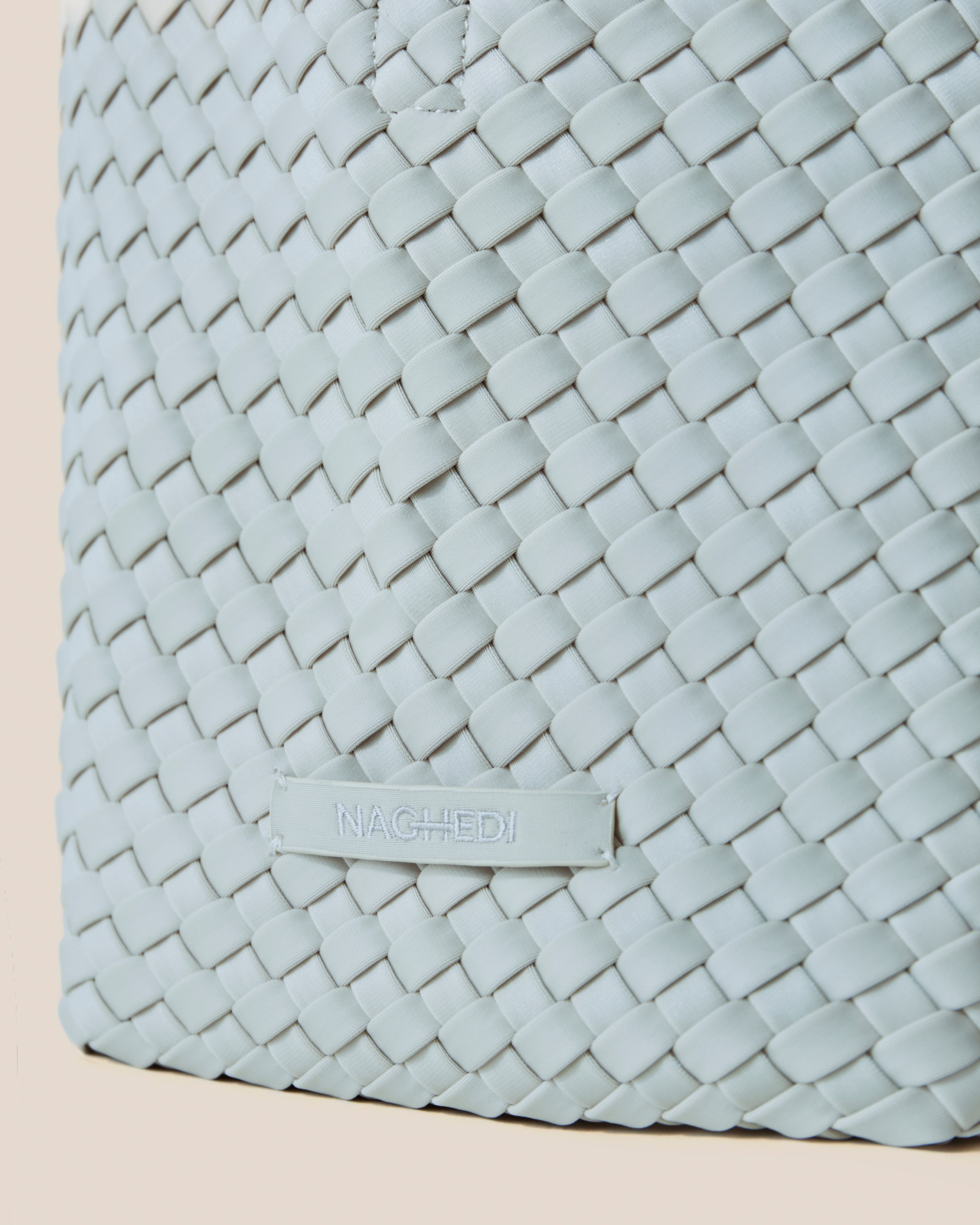 Close-up of stamped NAGHEDI logo on St. Barths Tote in Mist.