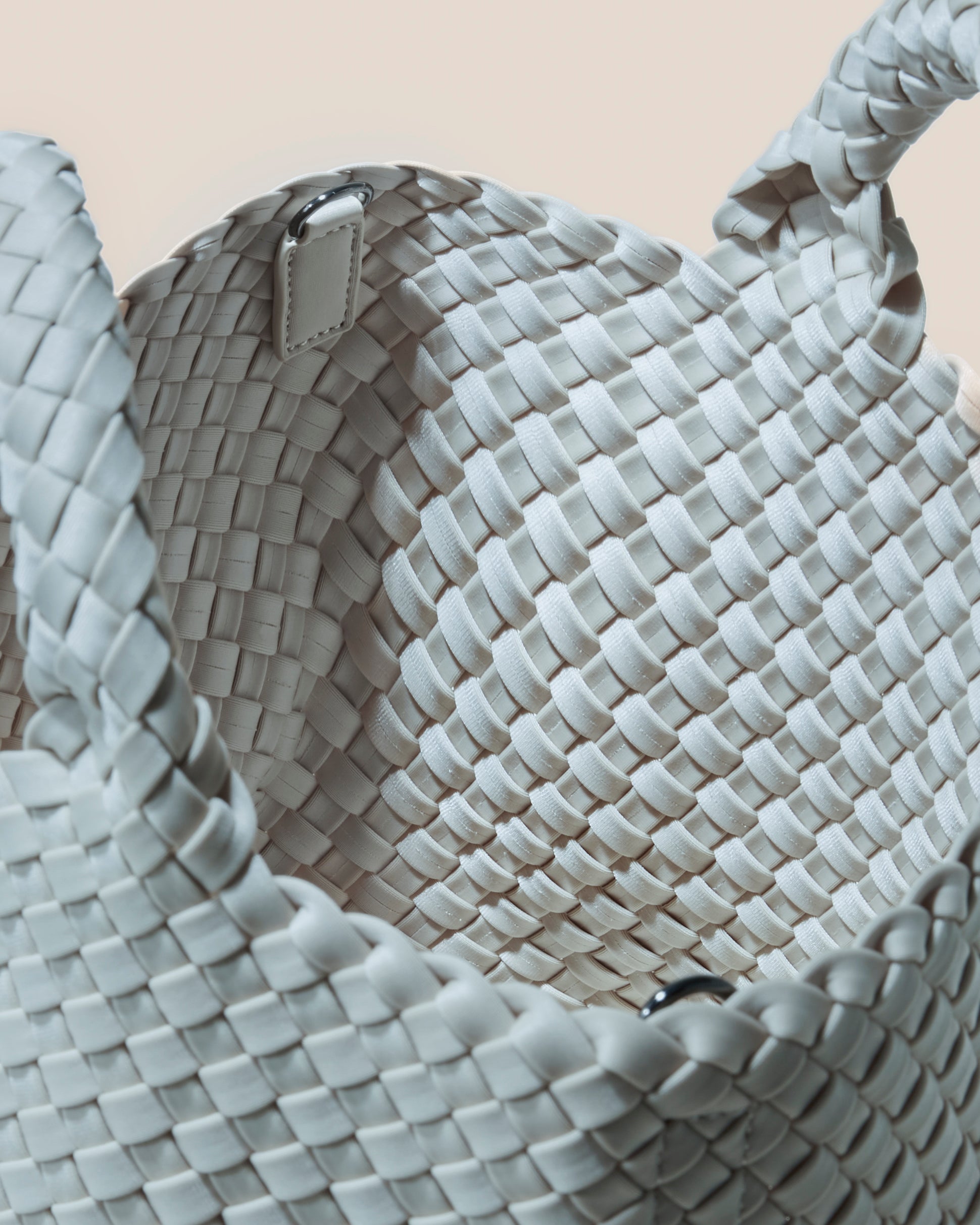 Interior close-up of St. Barths Tote in Mist showing its open top, and unlined interior.