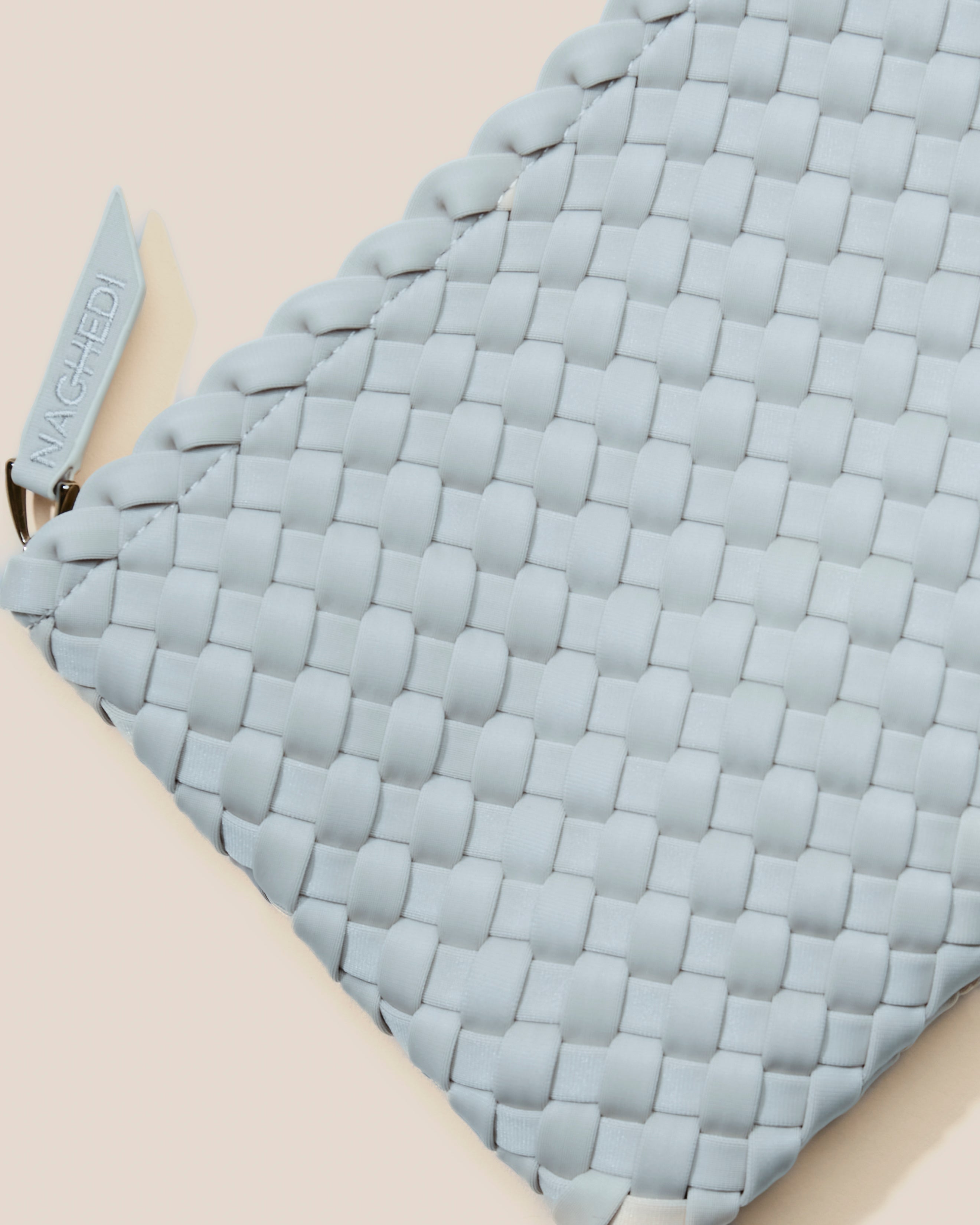 Close-up of included matching woven zippered pouch.