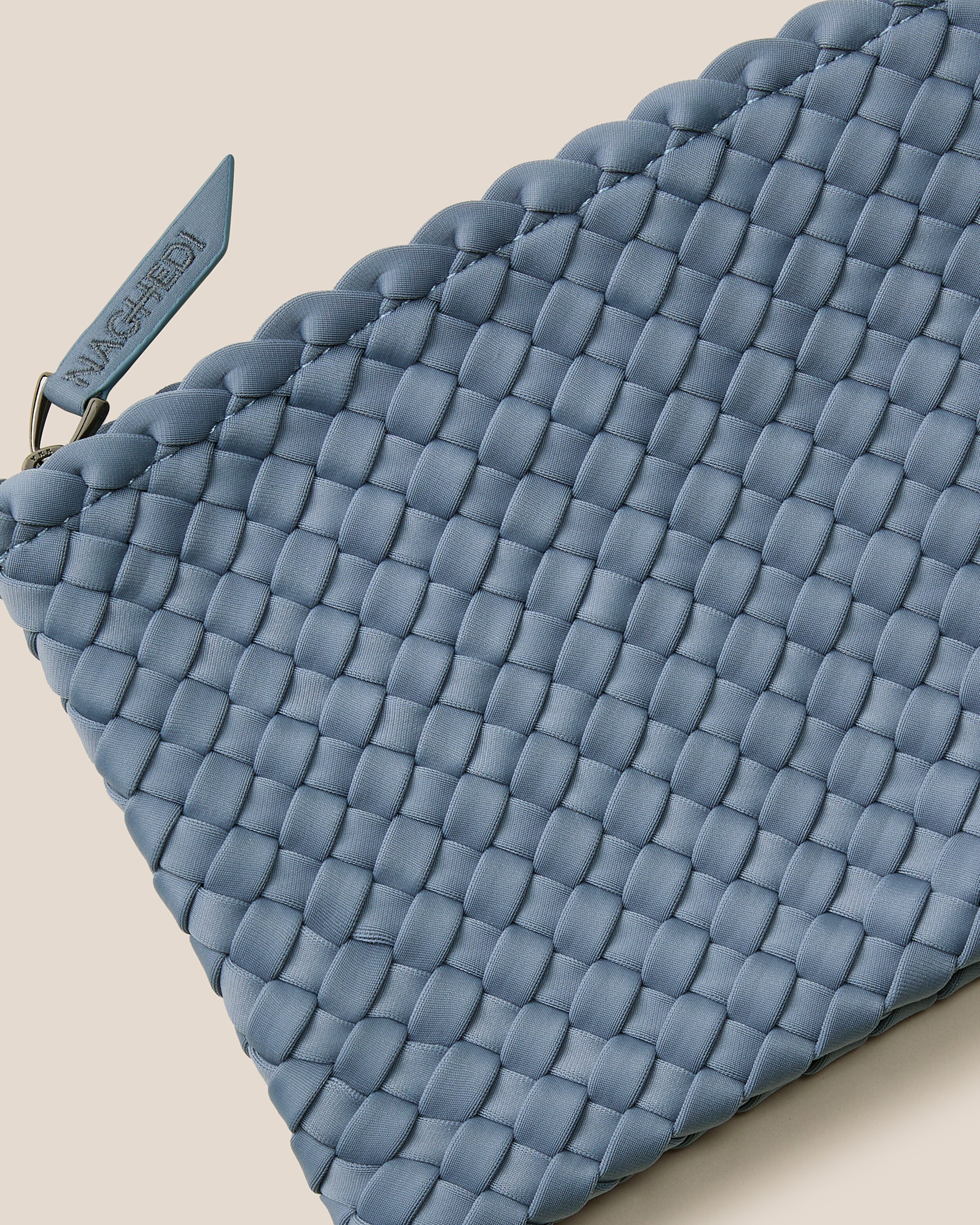 Close-up of included matching woven zippered pouch.