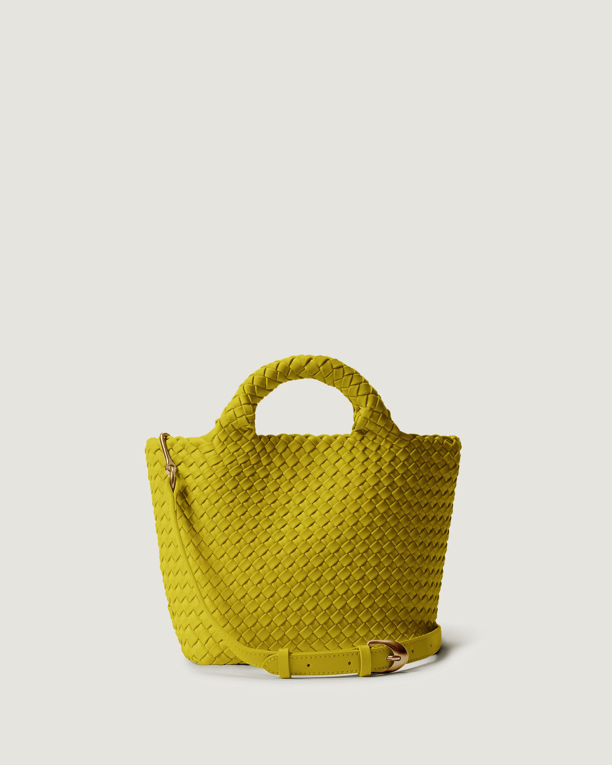 St. Barths Tote in Ochre in handwoven neoprene, featuring a magnetic closure, woven top handles, and detachable, adjustable leather crossbody strap.