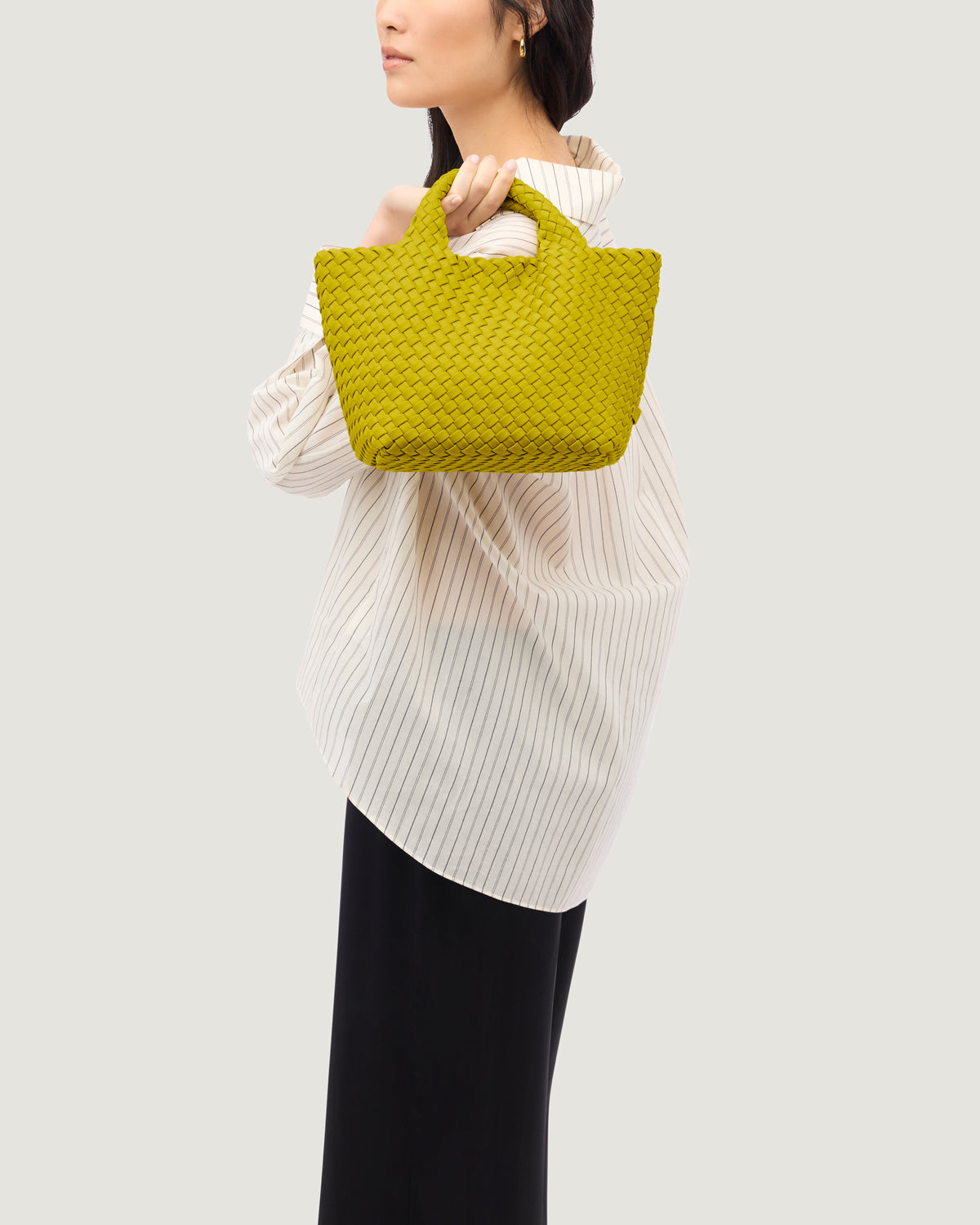 St. Barths Tote in Ochre shown on model to illustrate scale and soft silhouette.