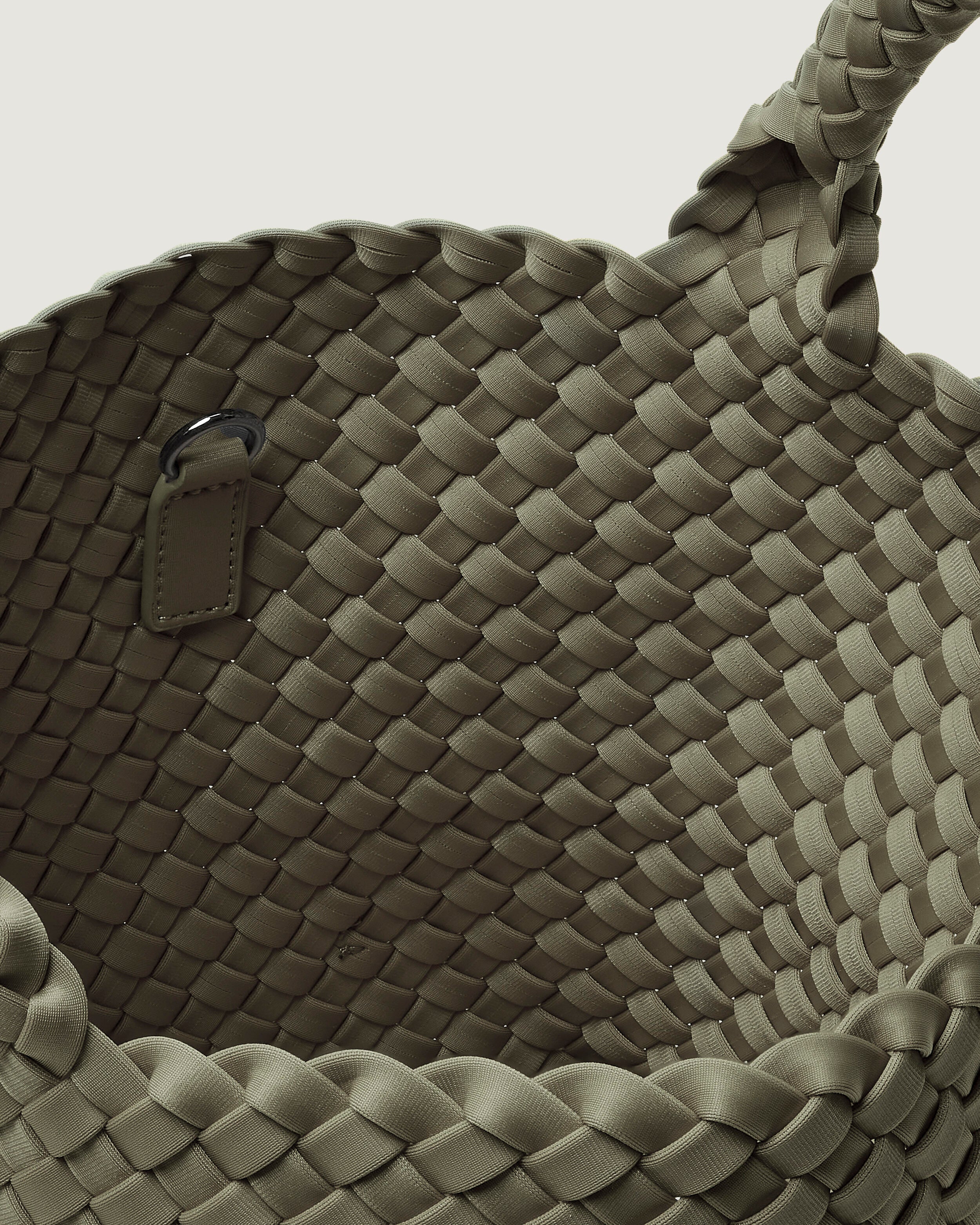 Interior close-up of St. Barths Tote in Olea showing its open top, and unlined interior.