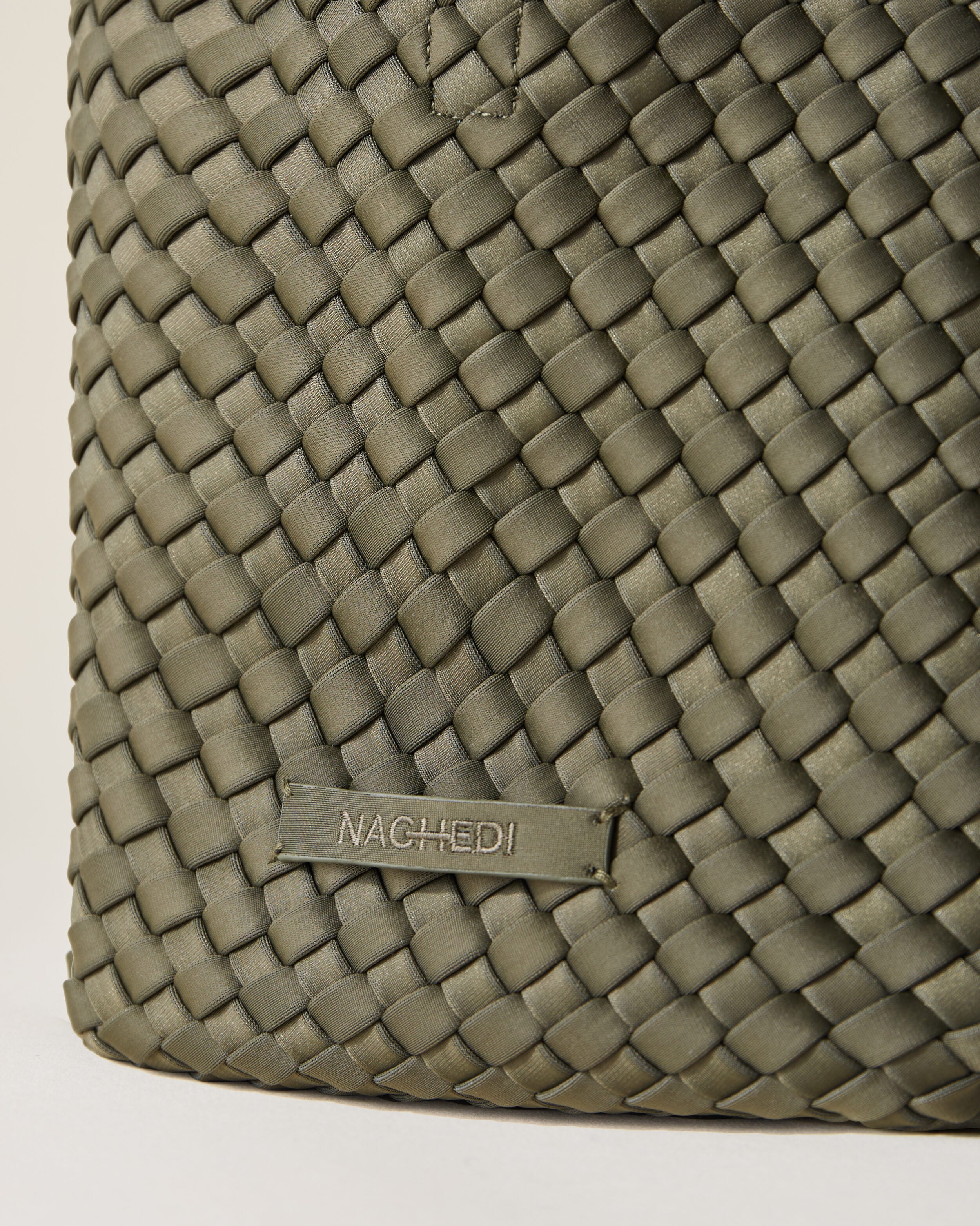 Close-up of stamped NAGHEDI logo on St. Barths Tote in Olive.
