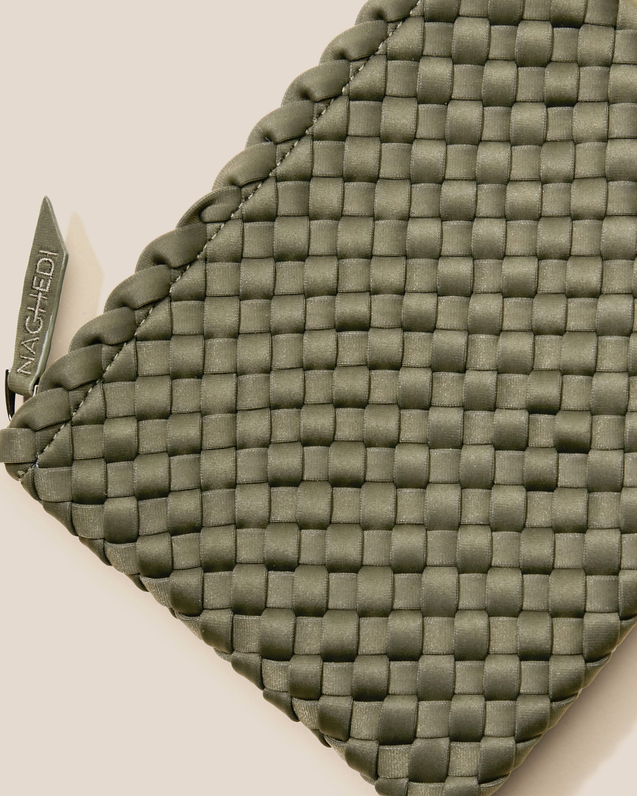 Close-up of included matching woven zippered pouch.