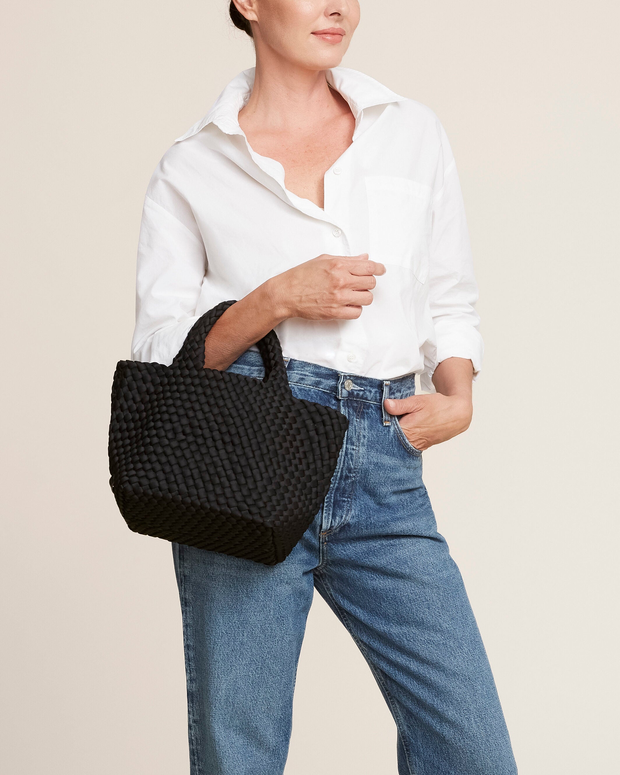 St. Barths Tote in Onyx shown on model to illustrate scale and soft silhouette.