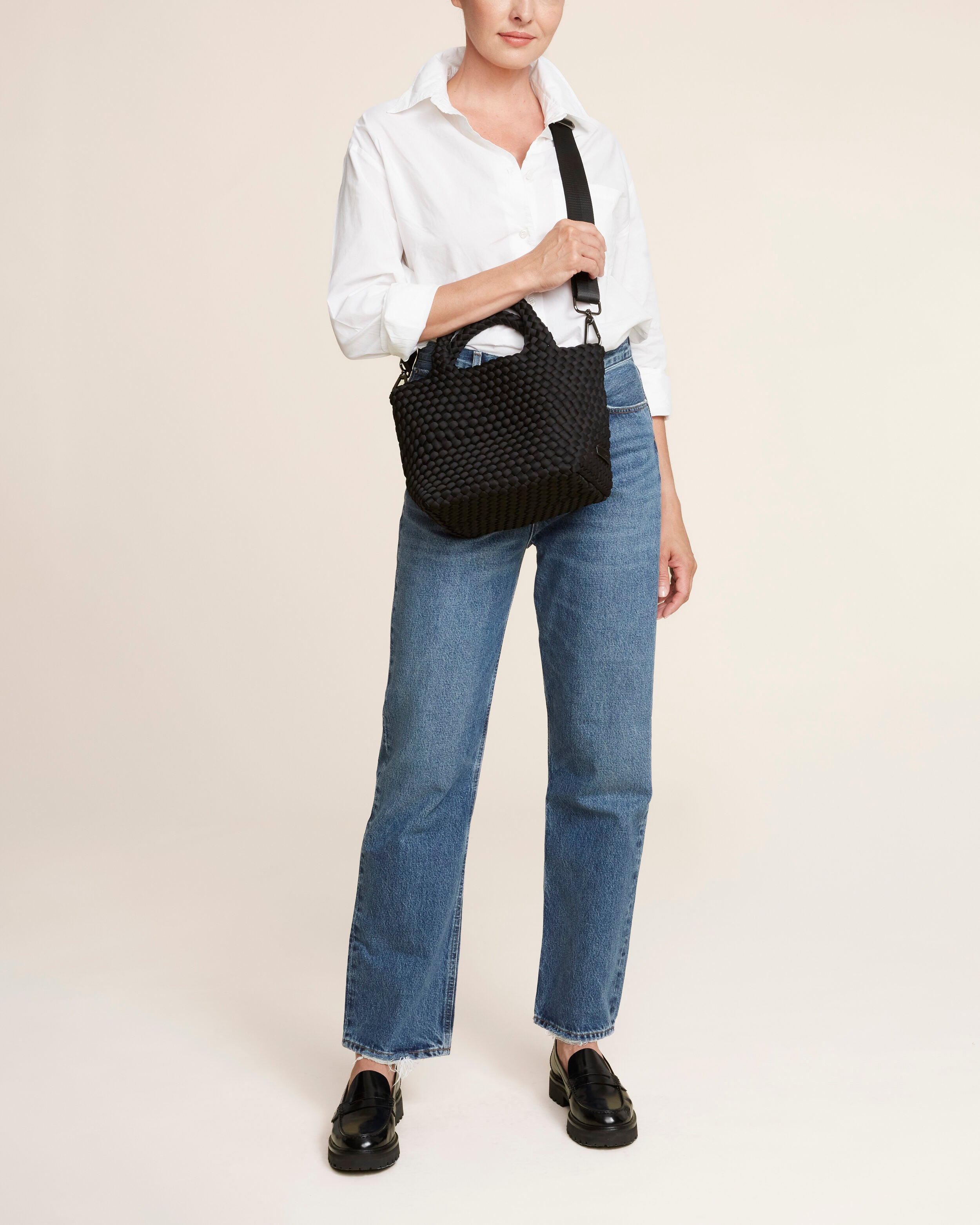 St. Barths Tote in Onyx shown on model to illustrate scale and soft silhouette.