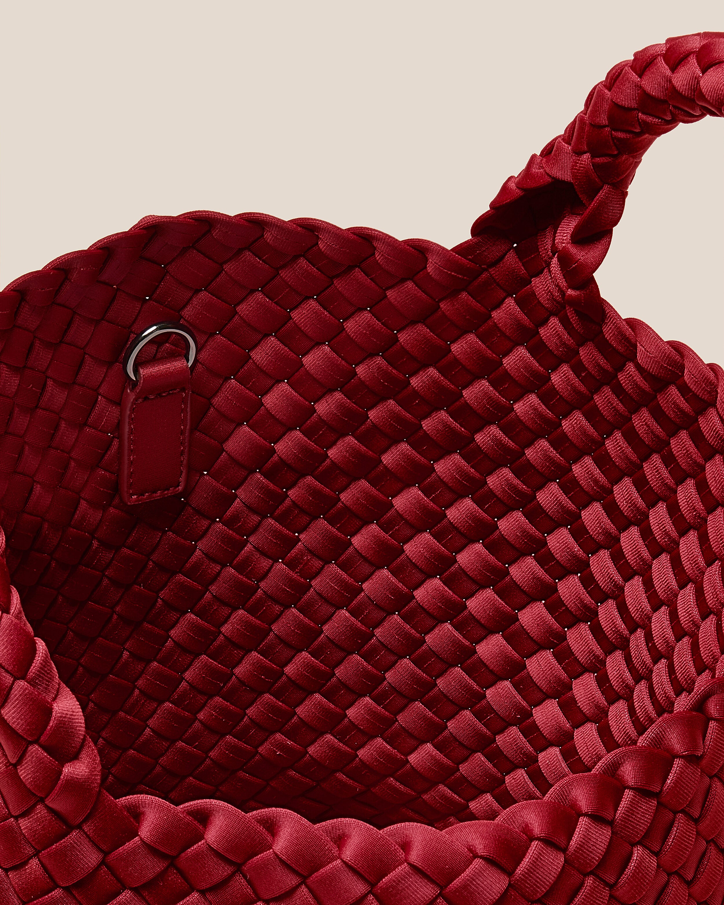 Interior close-up of St. Barths Tote in Rosso showing its open top, and unlined interior.