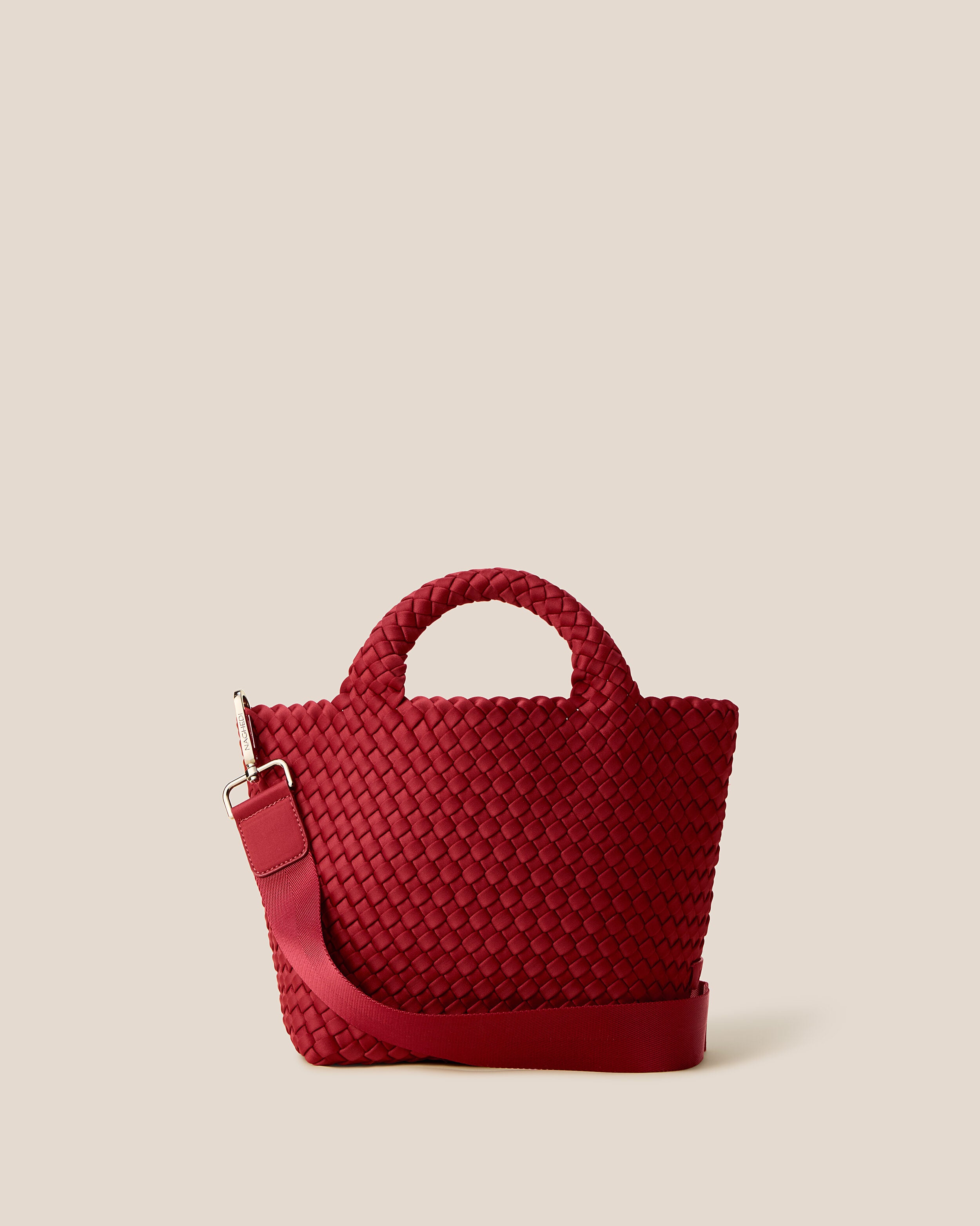 St. Barths Tote in Rosso, a rich red tone, in handwoven neoprene, featuring an open top, woven top handles, and detachable, adjustable nylon crossbody strap.