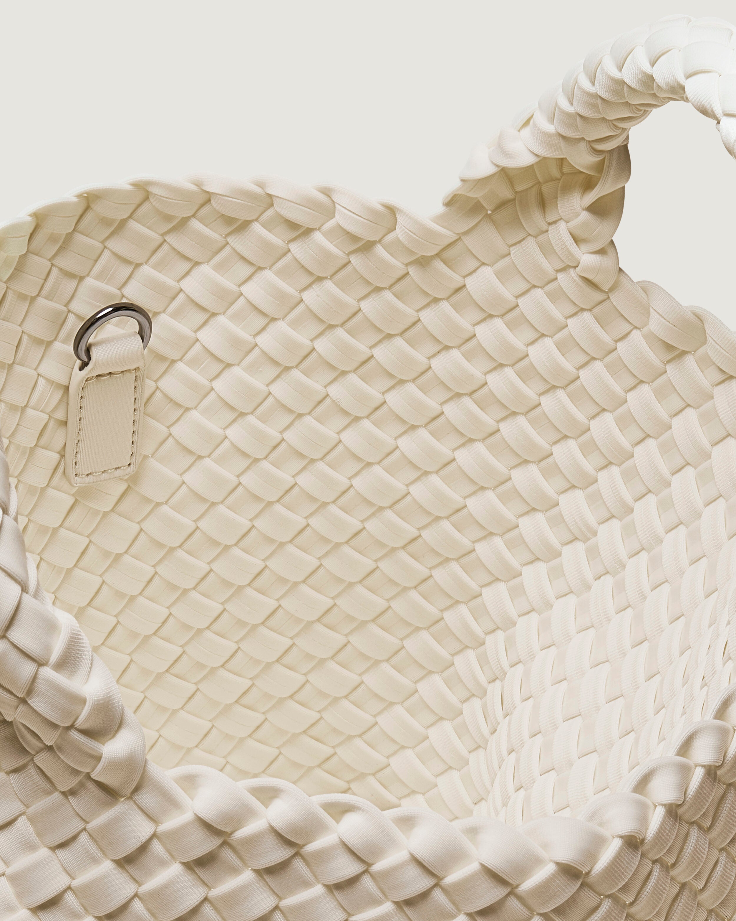 Interior close-up of St. Barths Tote in Salt showing its open top, and unlined interior.