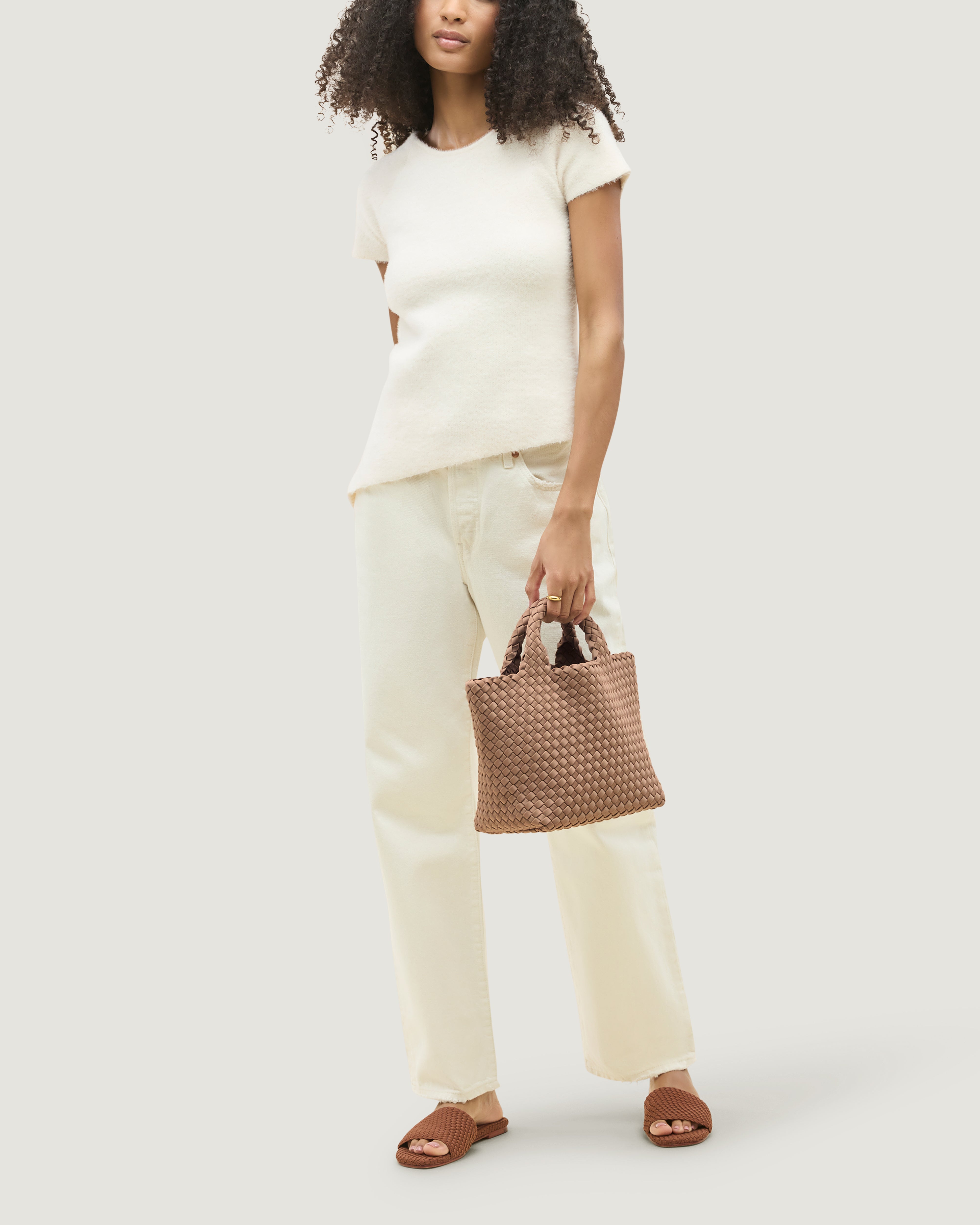 St. Barths Tote in Seychelles shown on model to illustrate scale and soft silhouette.