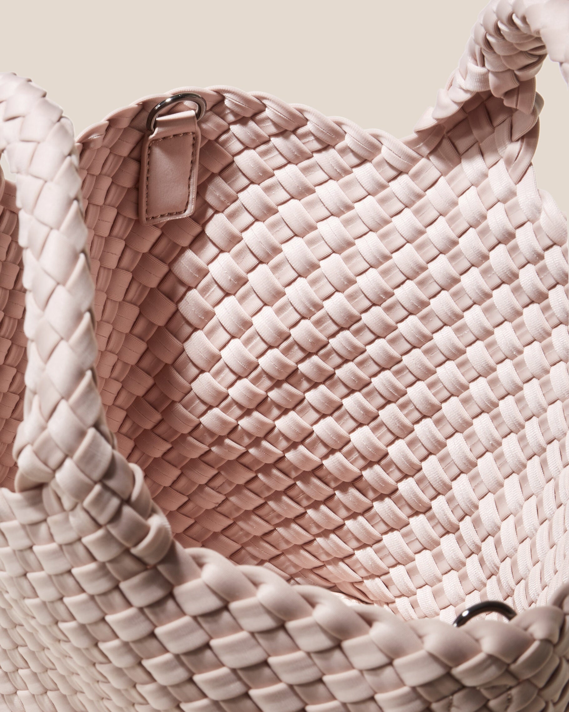 Interior close-up of St. Barths Tote in Shell Pink showing its open top, and unlined interior.