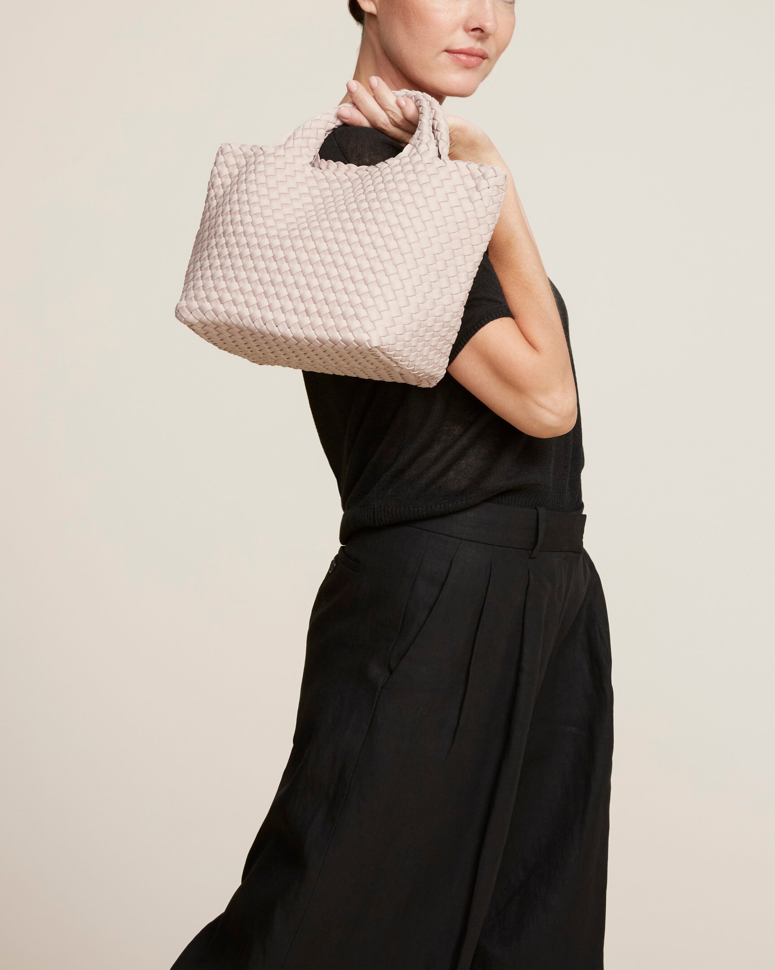 St. Barths Tote in Shell Pink shown on model to illustrate scale and soft silhouette.