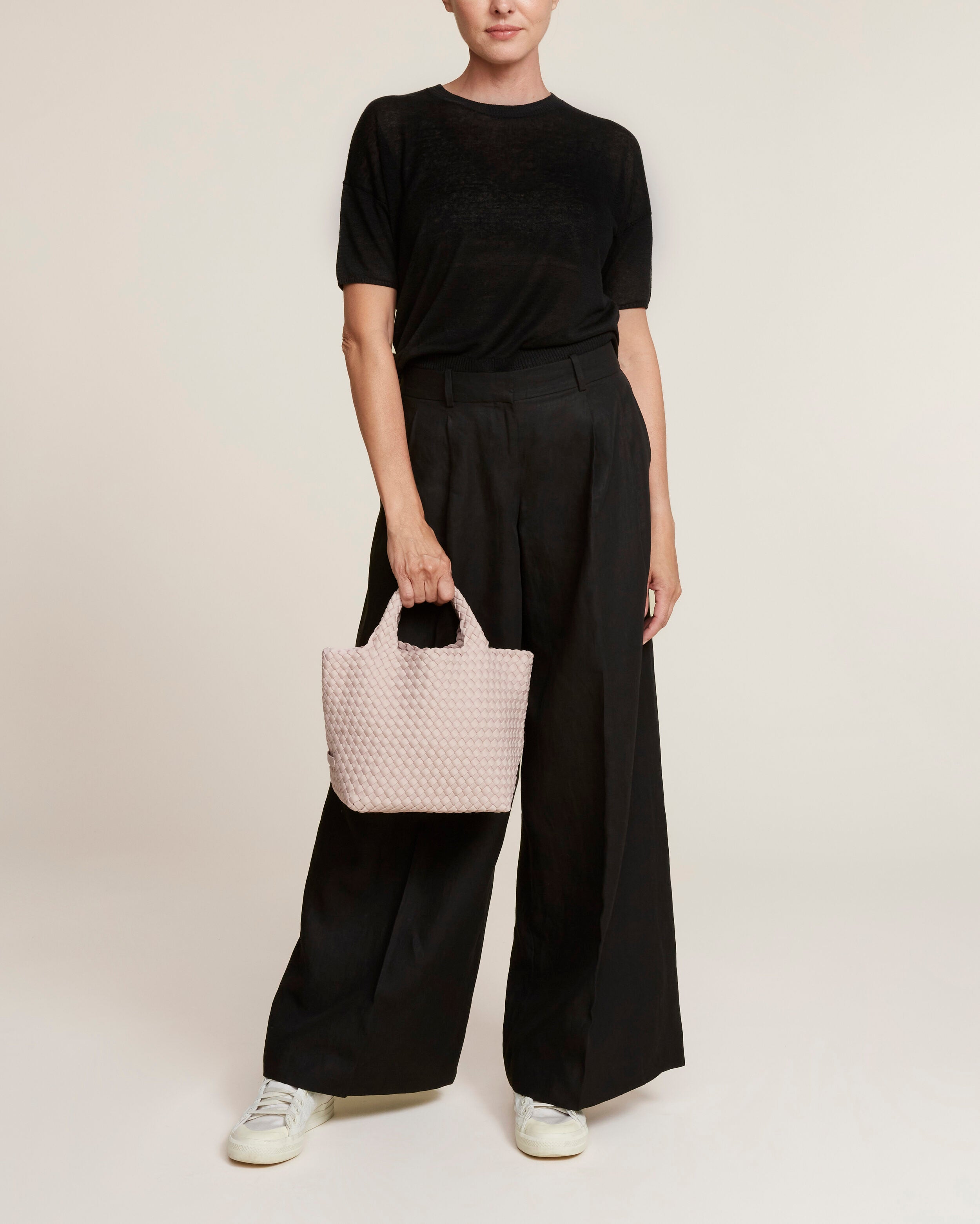 St. Barths Tote in Shell Pink shown on model to illustrate scale and soft silhouette.