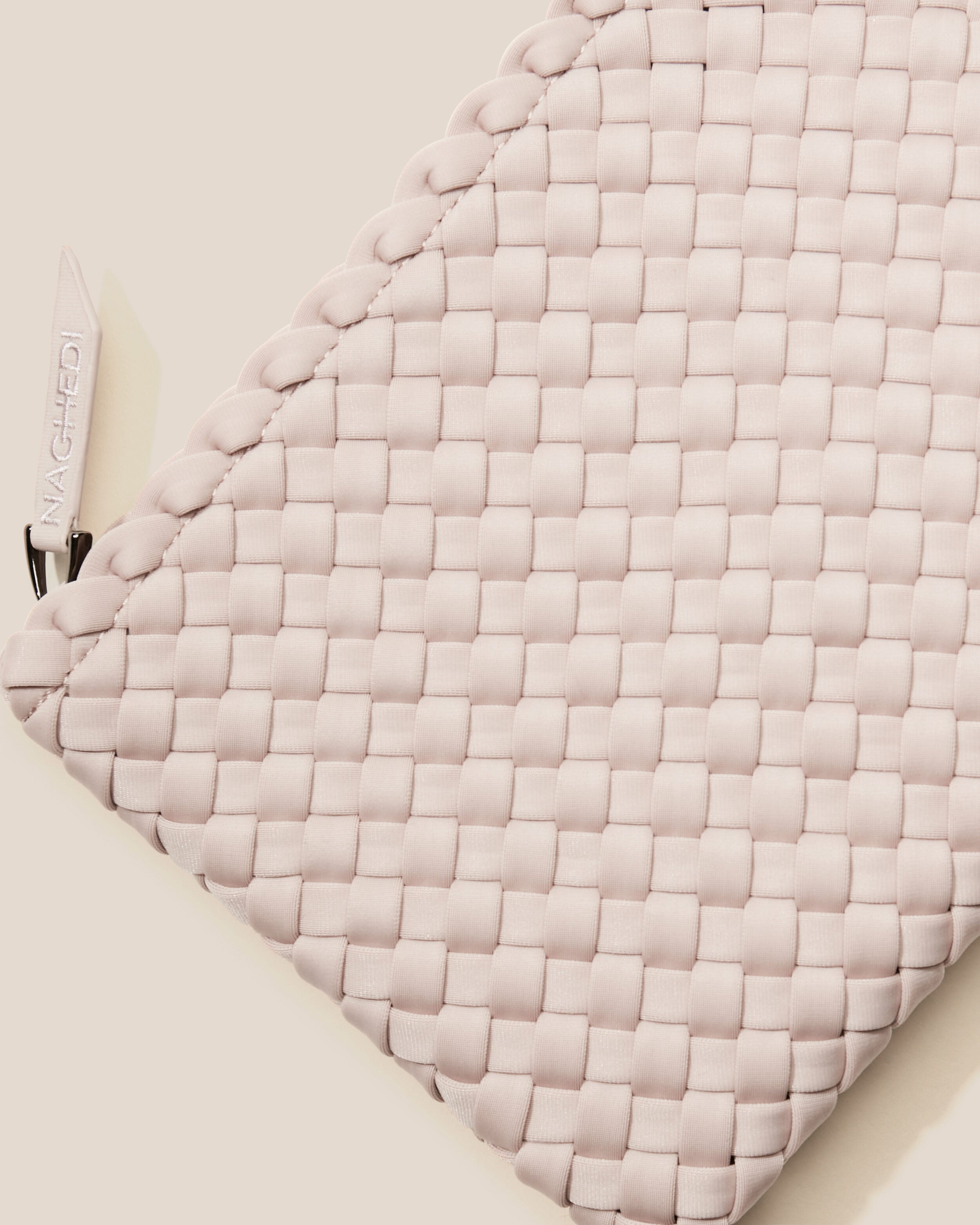 Close-up of included matching woven zippered pouch.