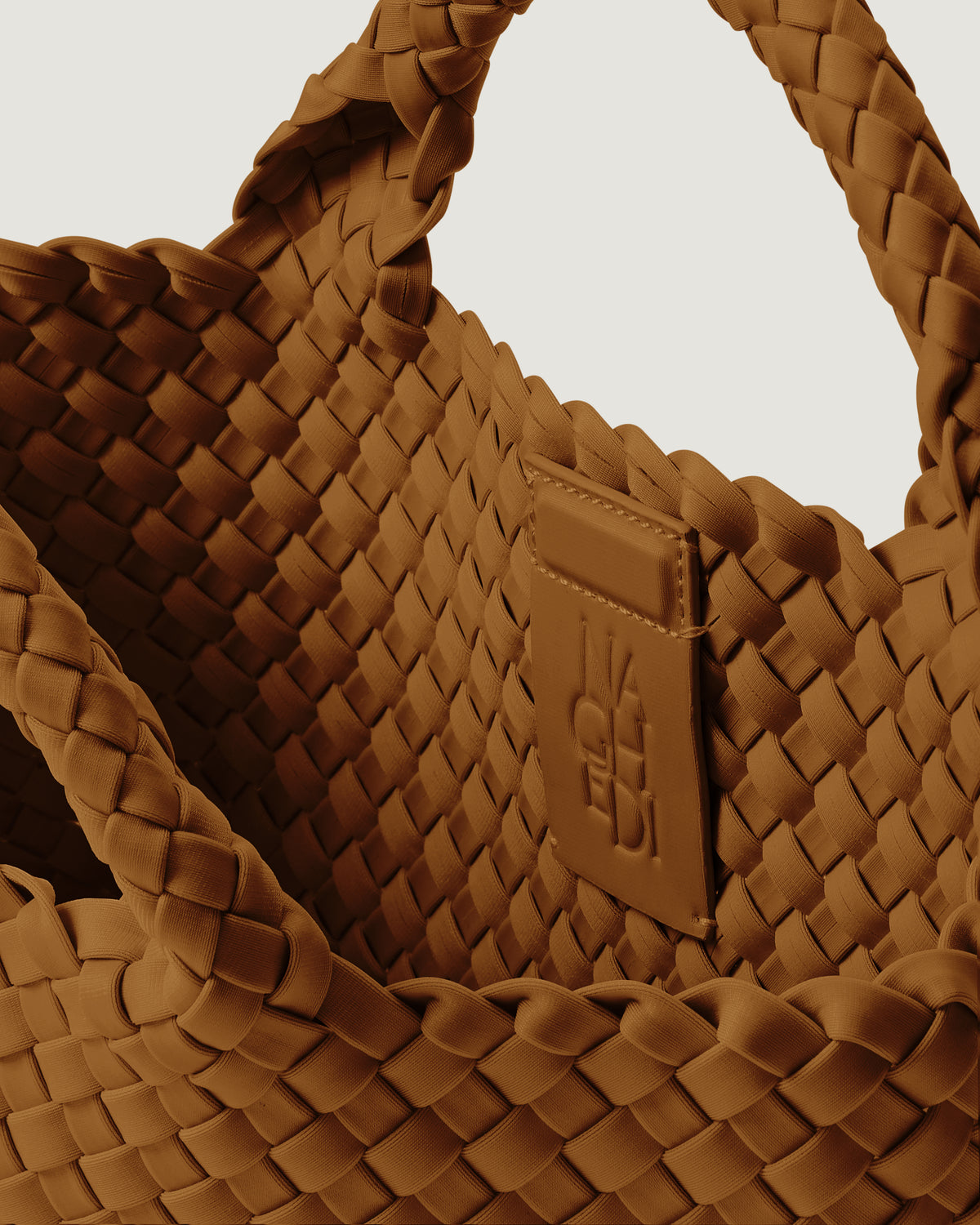 Interior close-up of St. Barths Tote in Teak showing its magnetic snap closure, and unlined interior.