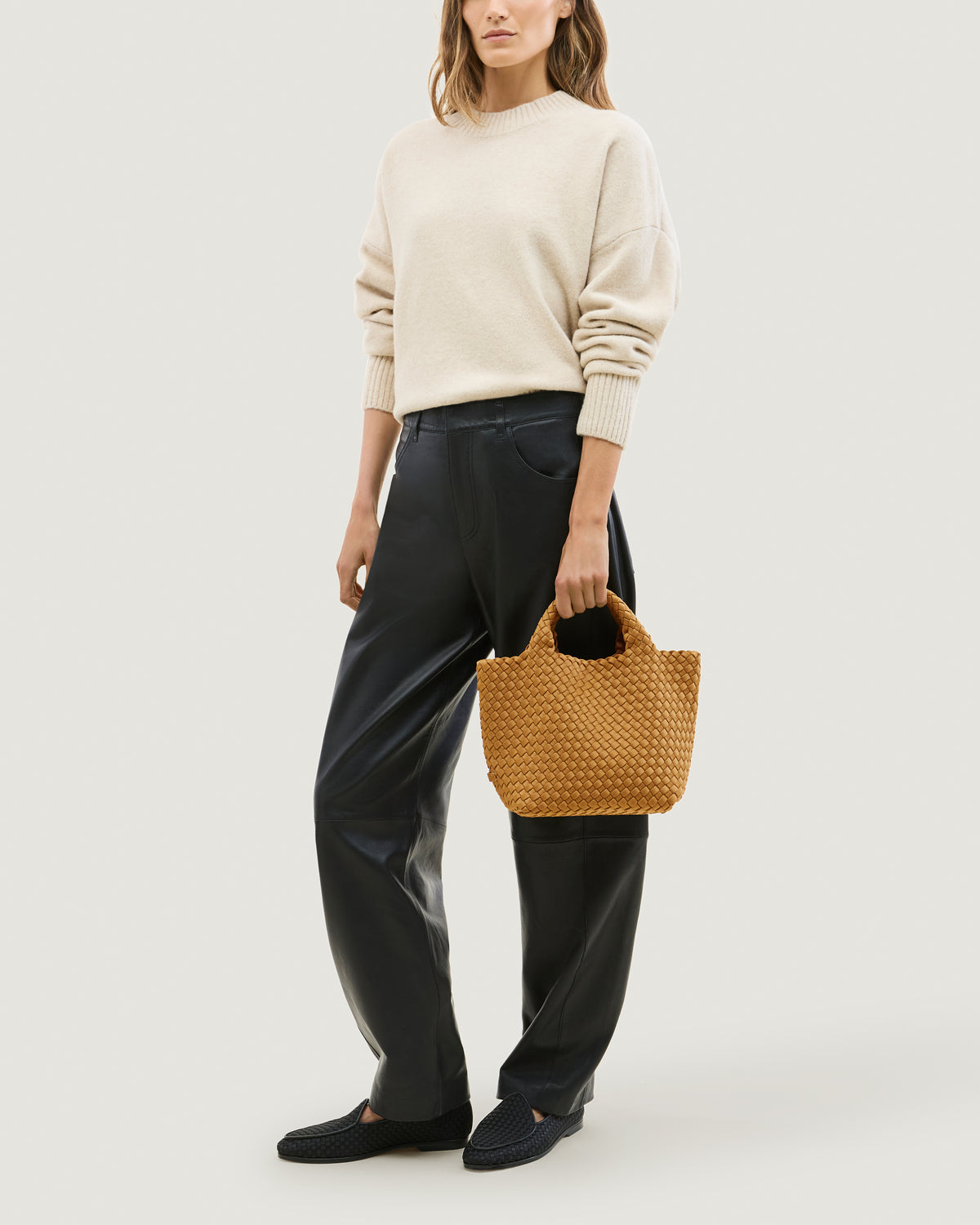 St. Barths Tote in Turmeric shown on model to illustrate scale and soft silhouette.