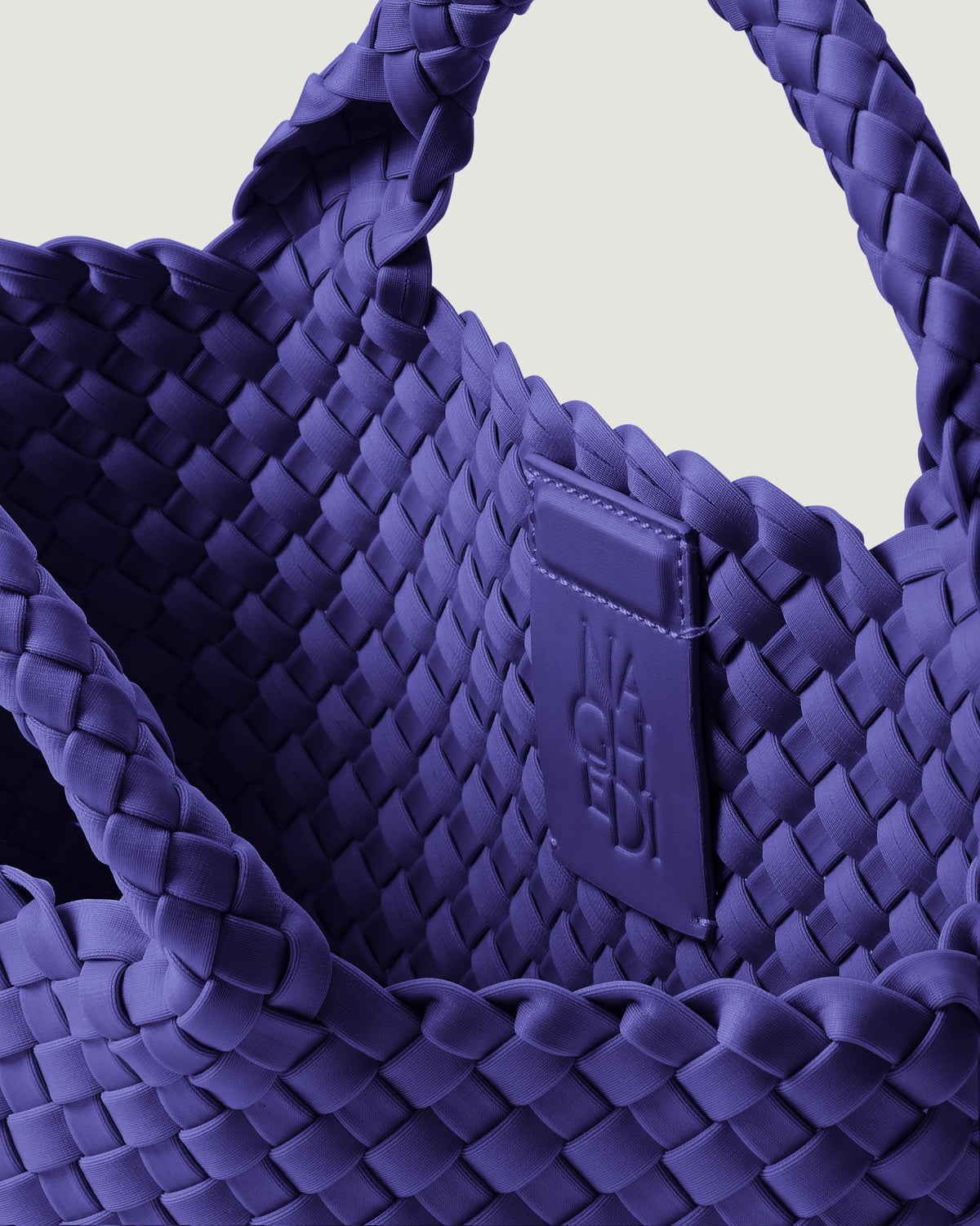 Interior close-up of St. Barths Tote in Ultramarine showing its magnetic snap closure, and unlined interior.