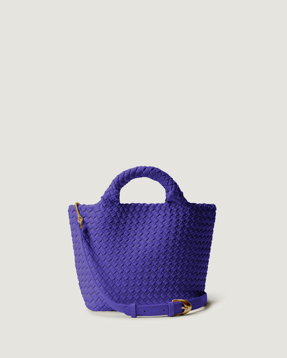 St. Barths Tote in Ultramarine in handwoven neoprene, featuring a magnetic closure, woven top handles, and detachable, adjustable leather crossbody strap.