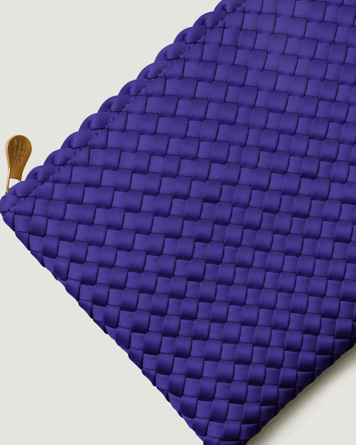Close-up of included matching woven zippered pouch.
