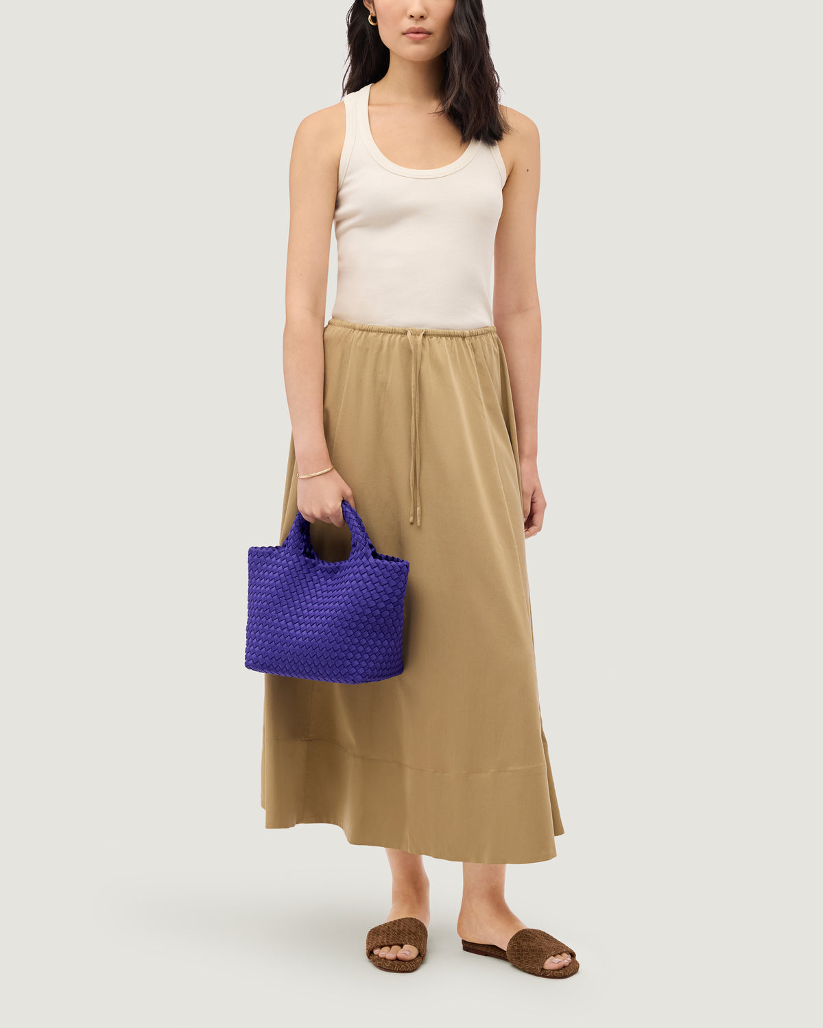 St. Barths Tote in Ultramarine shown on model to illustrate scale and soft silhouette.