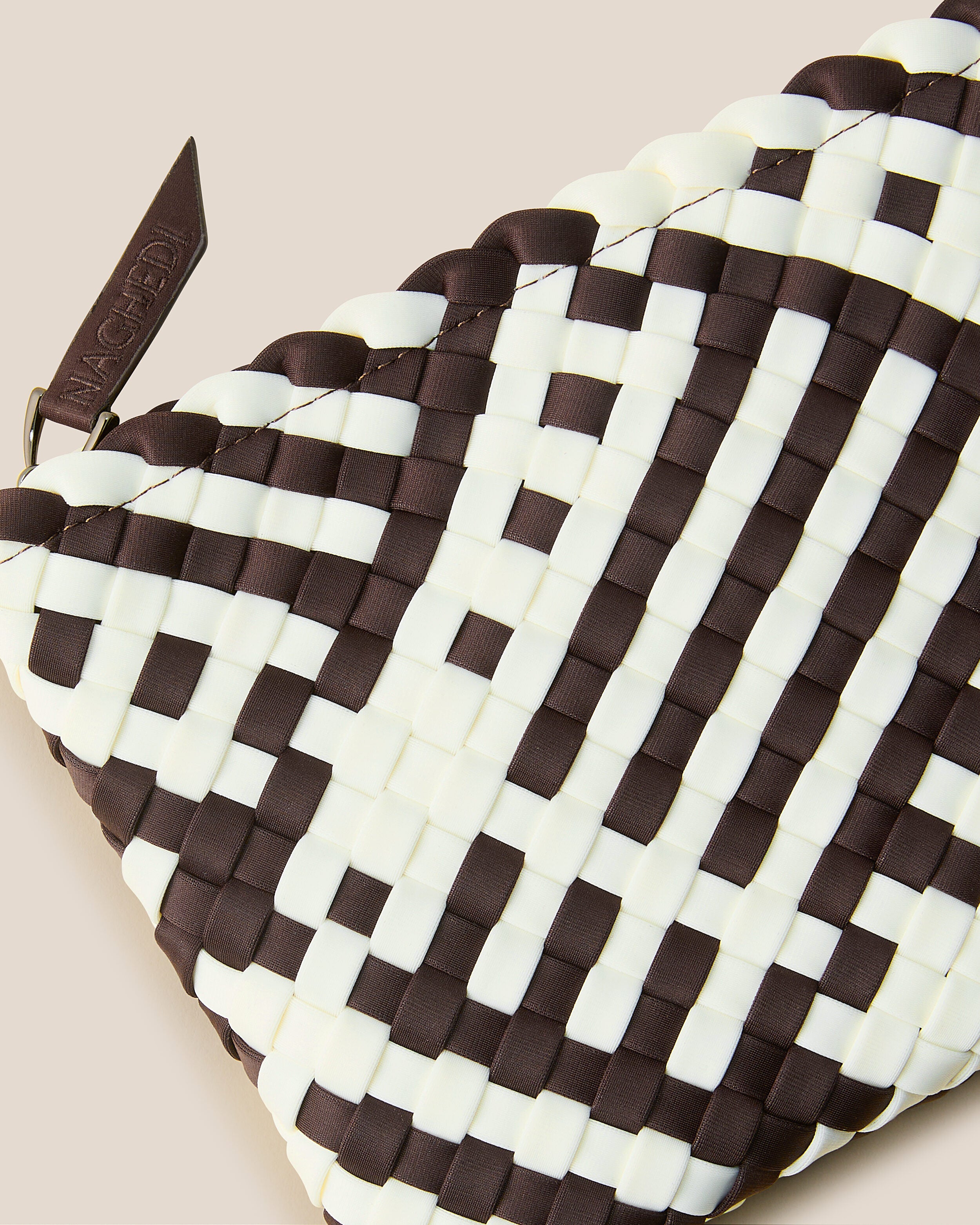 Close-up of included matching woven zippered pouch.