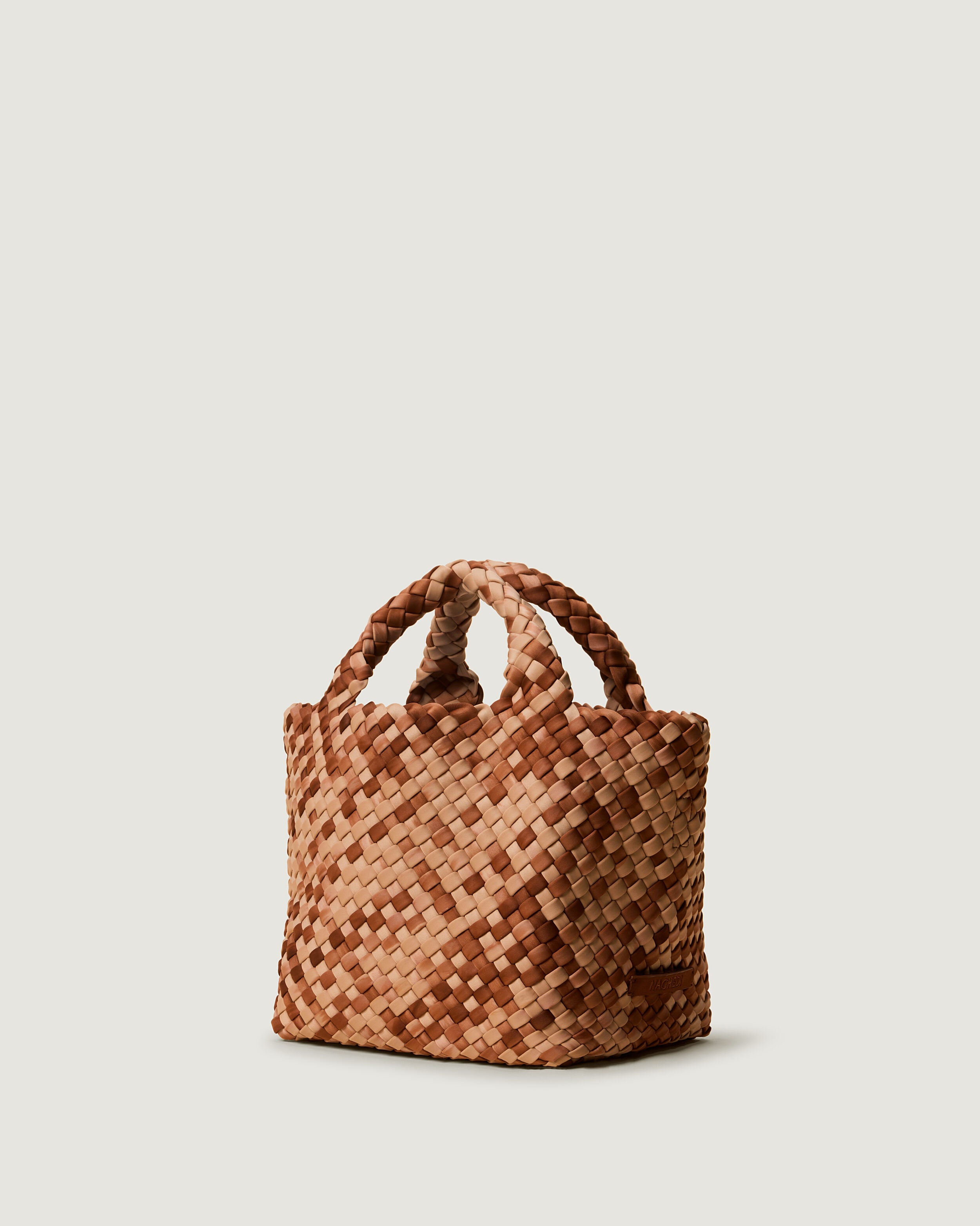 St. Barths Tote in Fez shown from a side angle, highlighting its handwoven neoprene construction and open top.