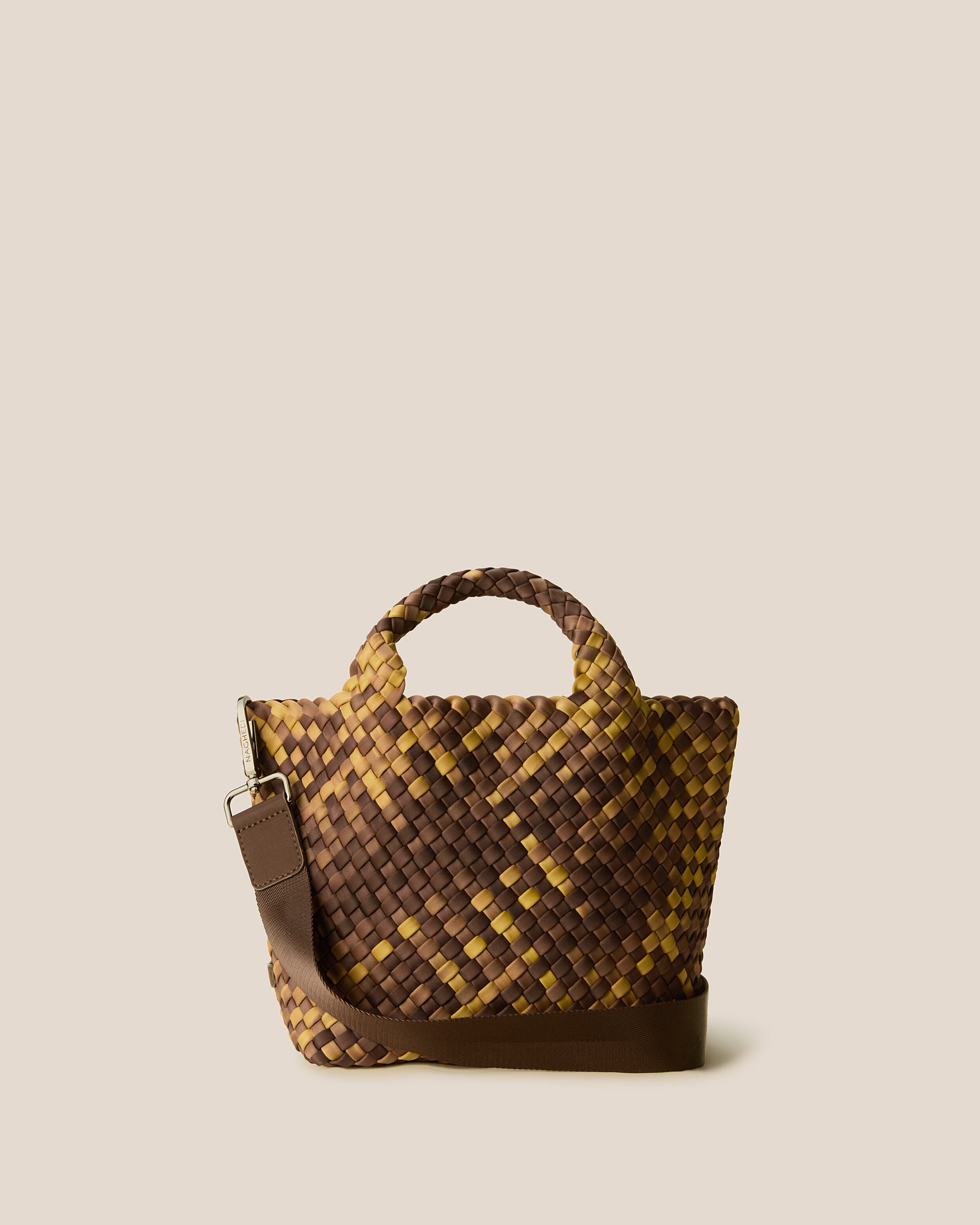 St. Barths Tote in Tortoiseshell, a mustard gold and dark chocolate brown tone, in handwoven neoprene, featuring an open top, woven top handles, and detachable, adjustable nylon crossbody strap.