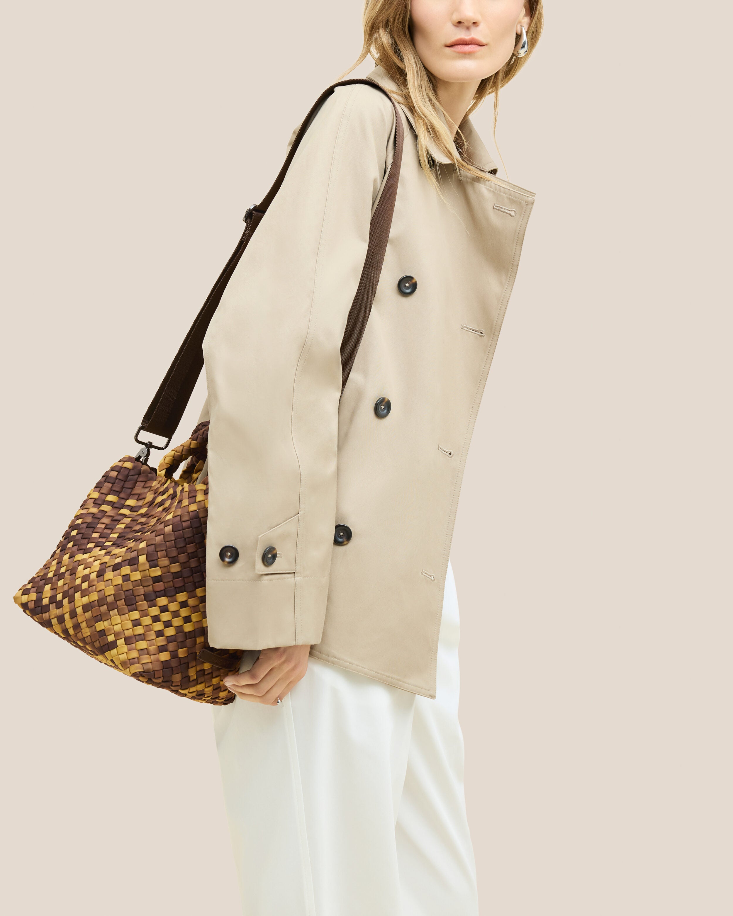 St. Barths Tote in Tortoiseshell shown on model to illustrate scale and soft silhouette.