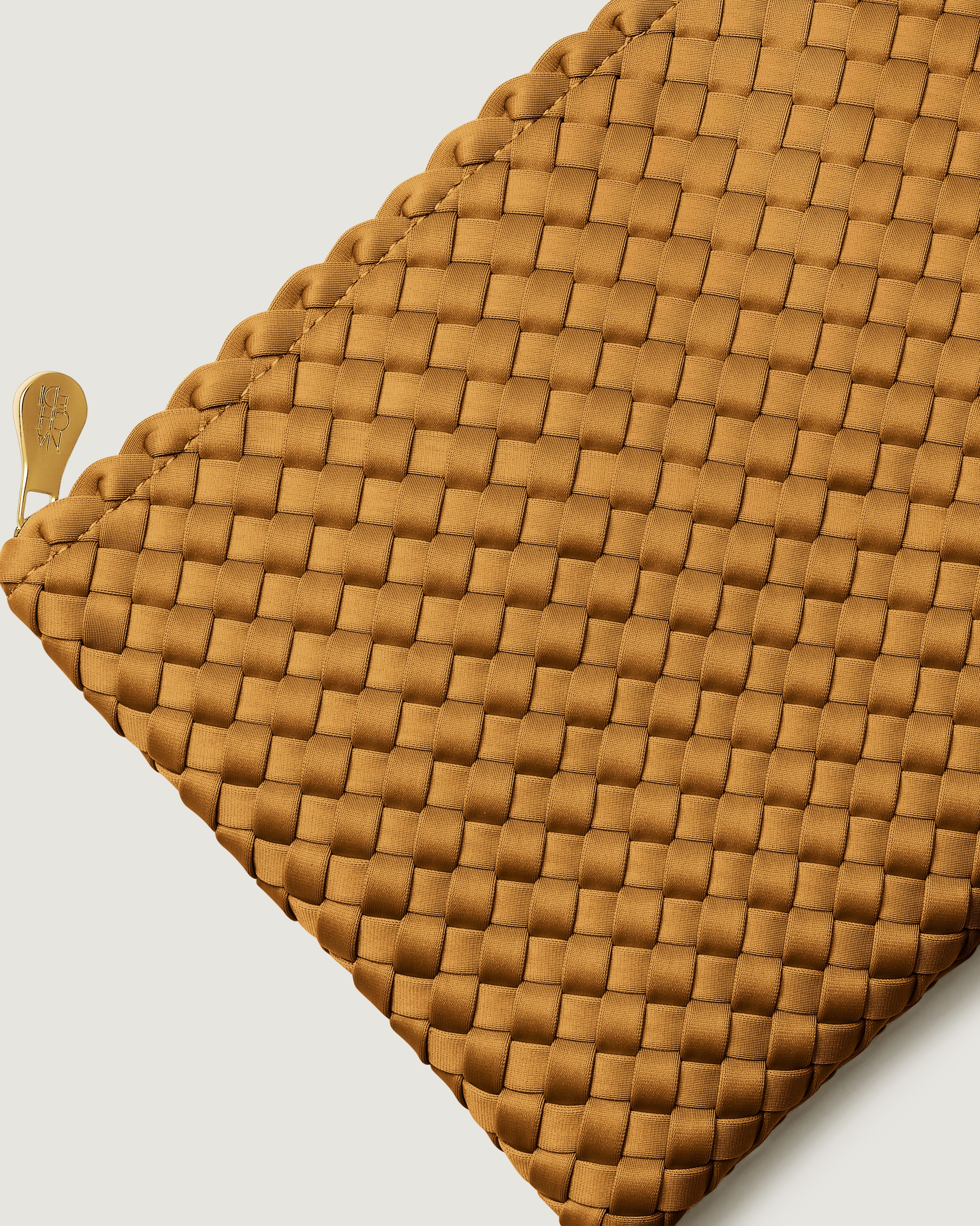 Close-up of included matching woven zippered pouch.