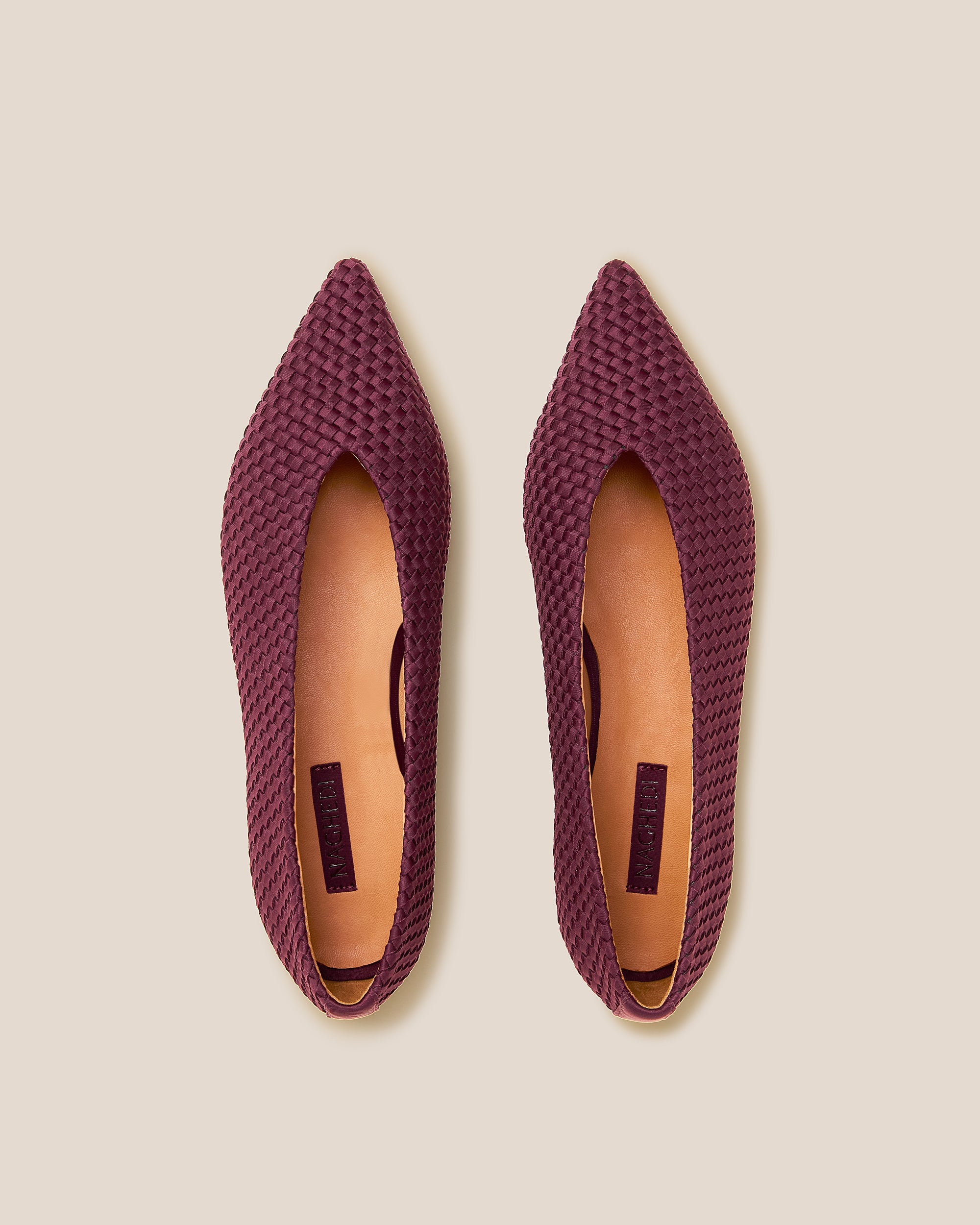 Top view of pair of Strada Flats in Bordeaux showing the handwoven neoprene insole.