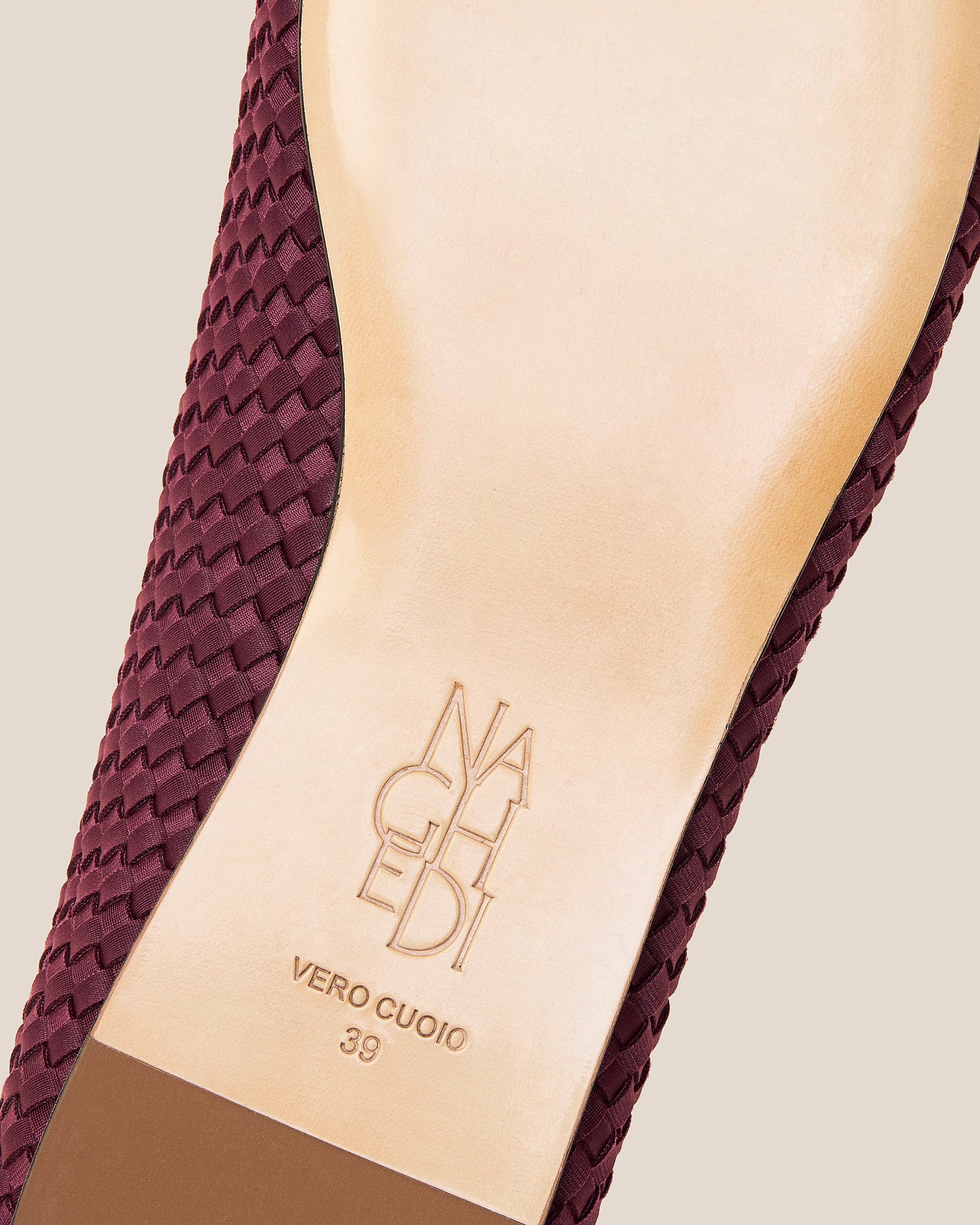 Shoe sole showing natural buffed leather sole, stamped NAGHEDI logo and size detail for Strada Flats in Bordeaux.