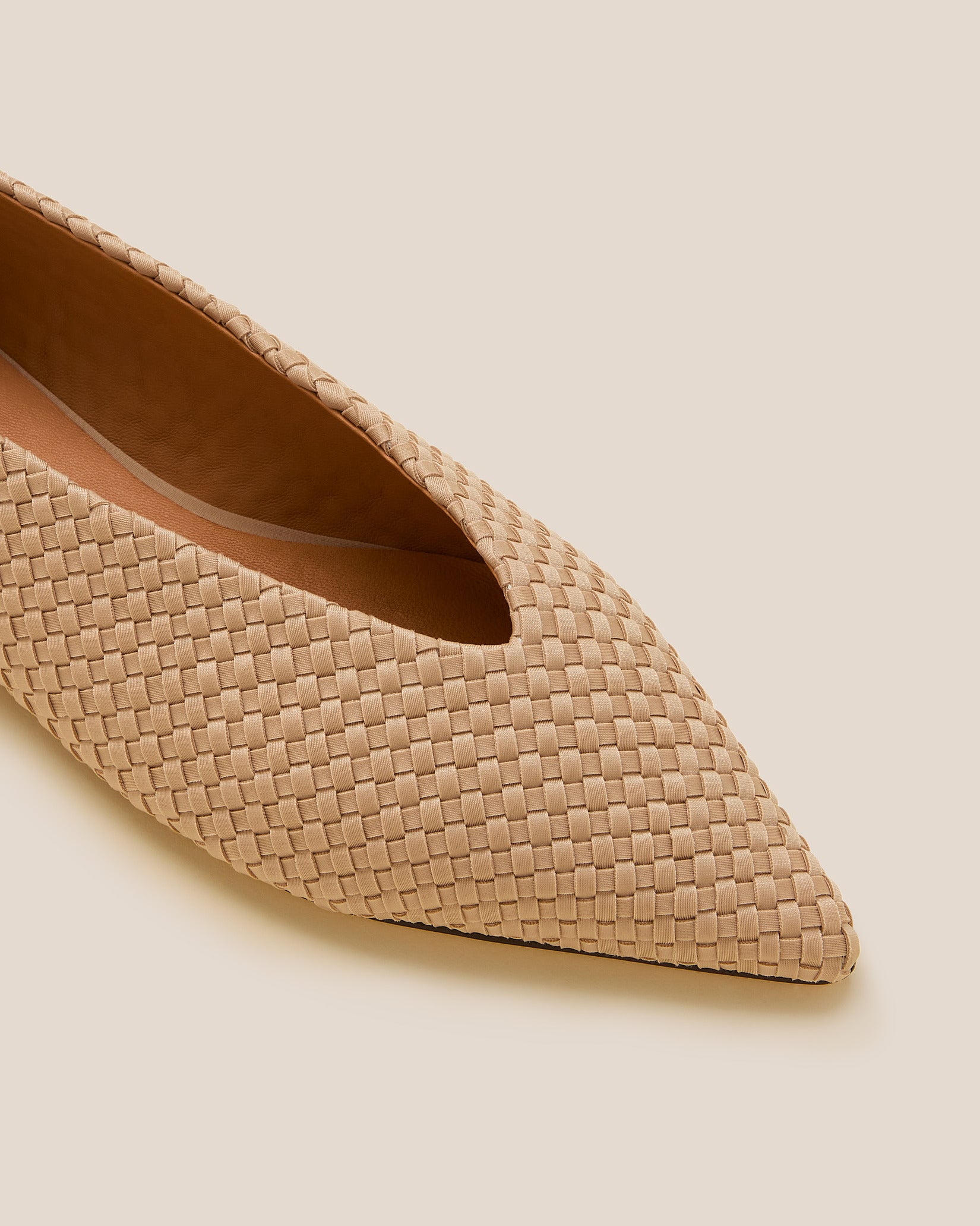 Close-up of Strada Flats in Camel showing its closed toe and pointed silhouette.