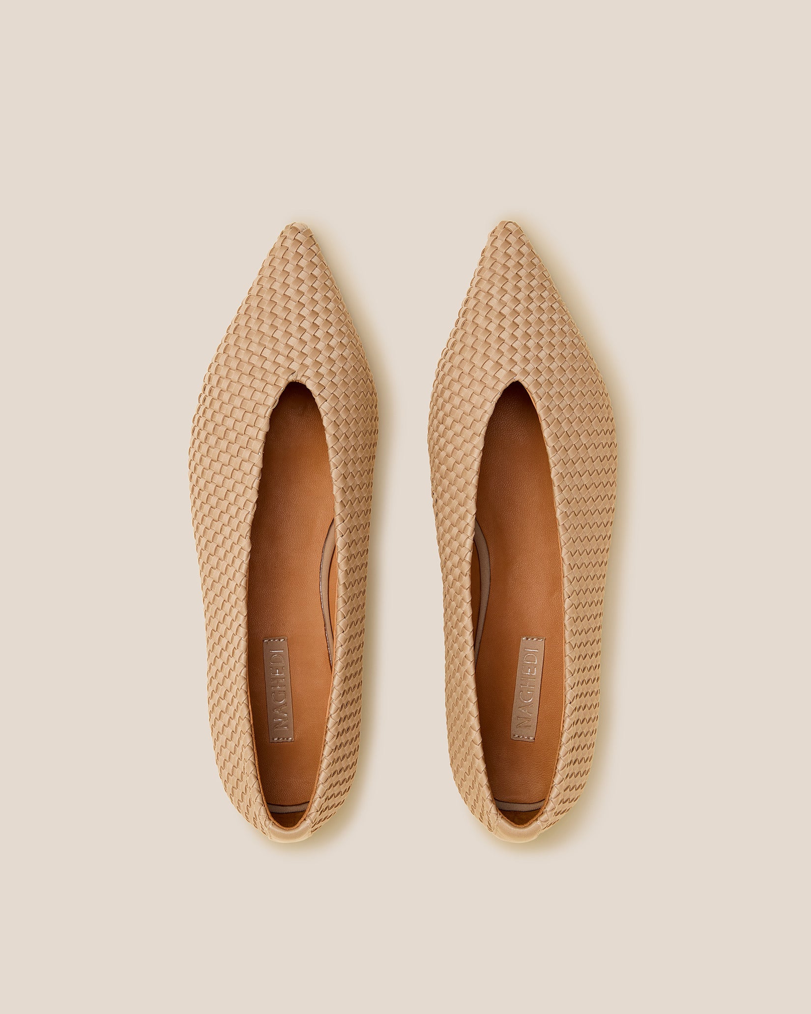 Top view of pair of Strada Flats in Camel showing the handwoven neoprene insole.